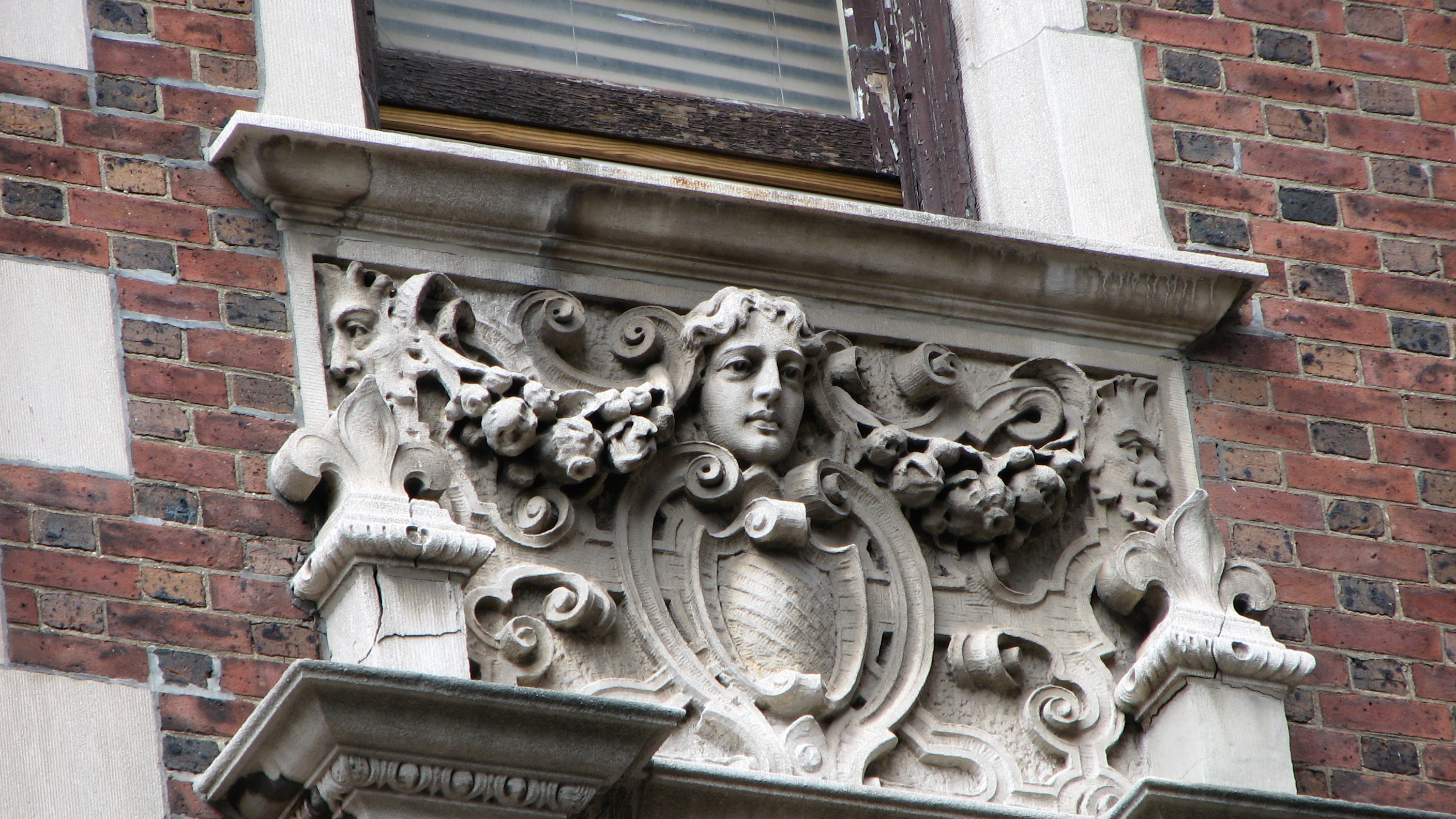 A carved stone detail at 1923 Walnut.