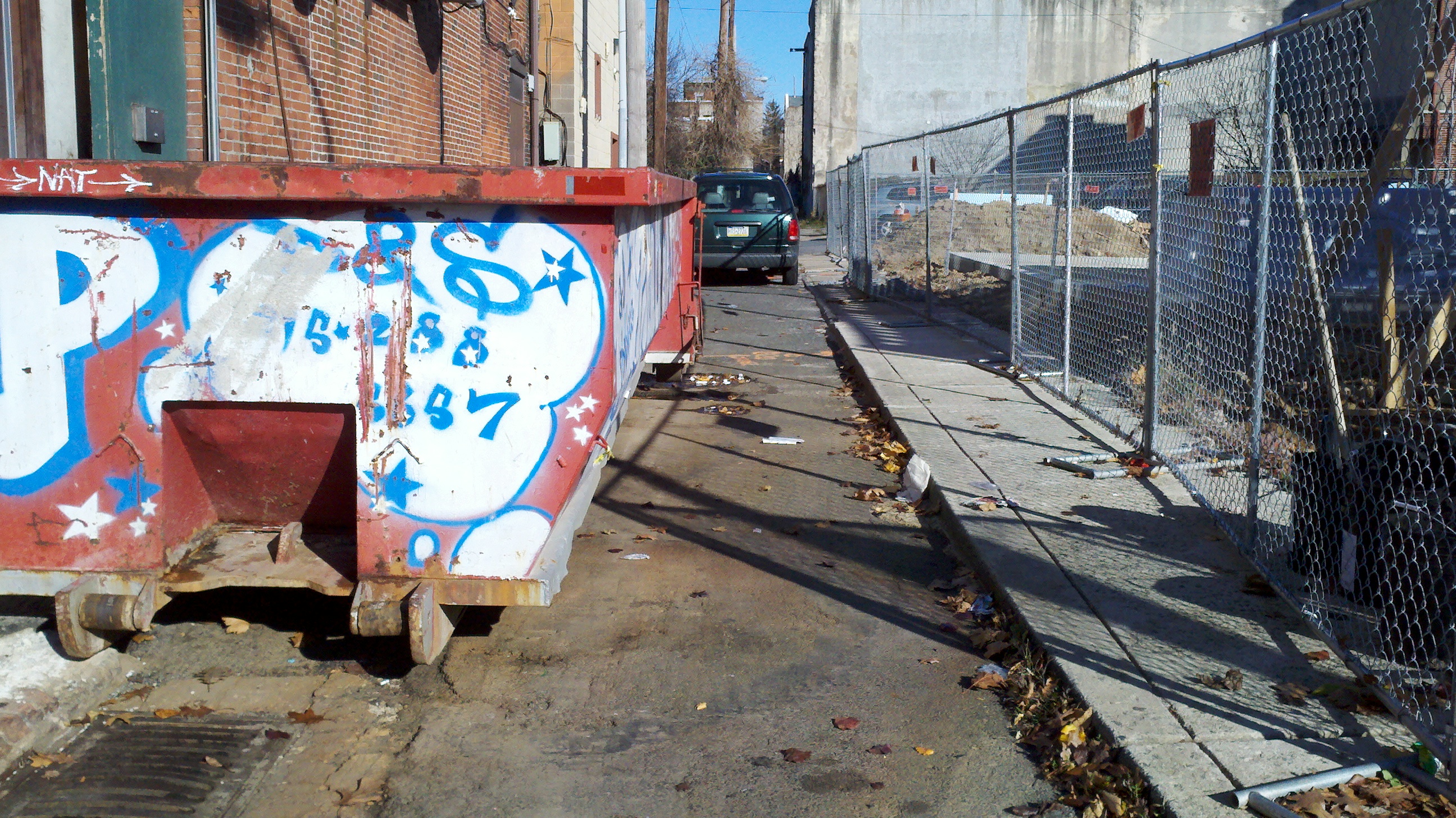 This dumpster sits near Finnegan's Wake on  Bodine Street