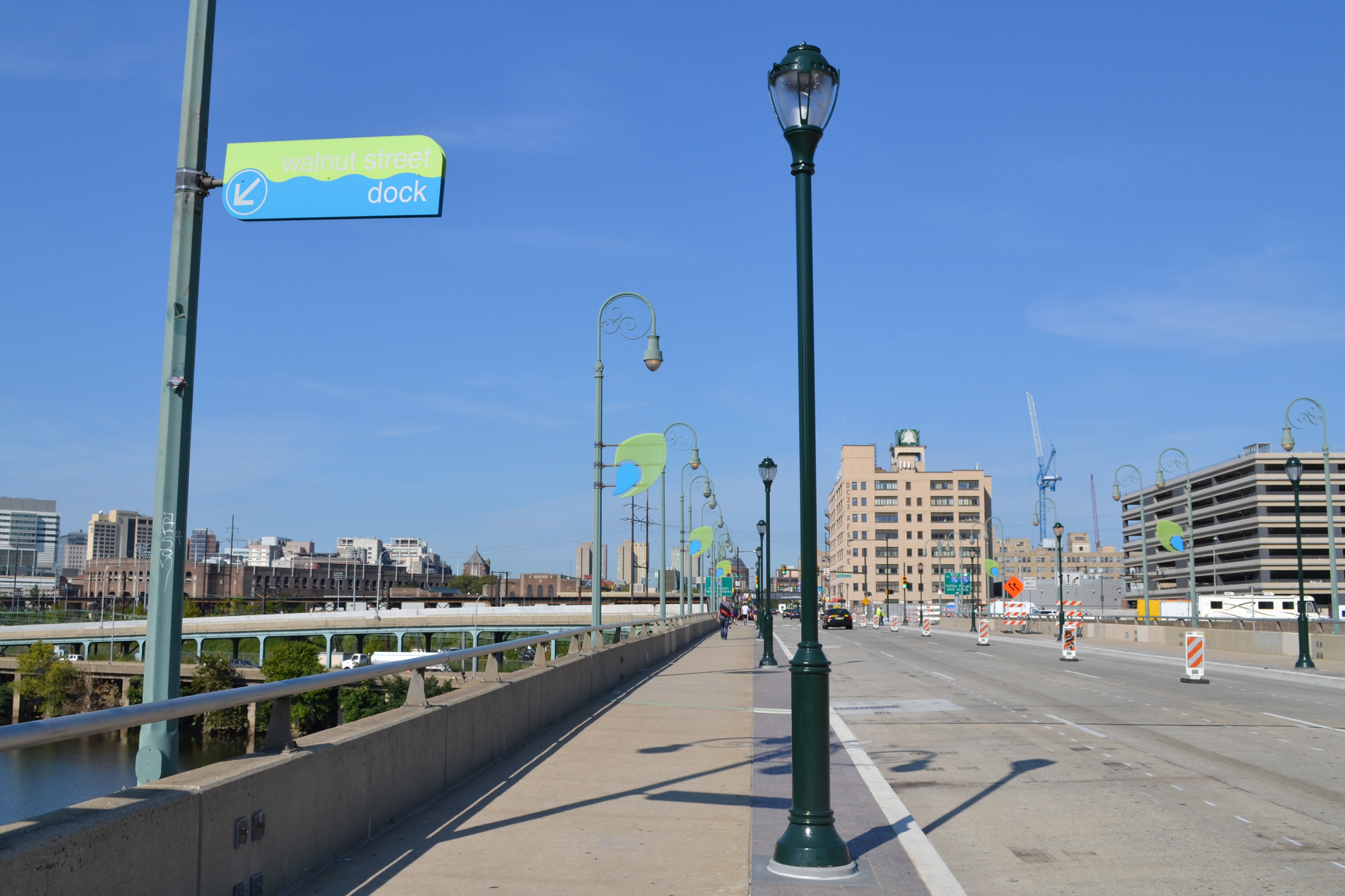 The new Walnut Street Bridge design includes widened sidewalks and pedestrian-scale lighting 