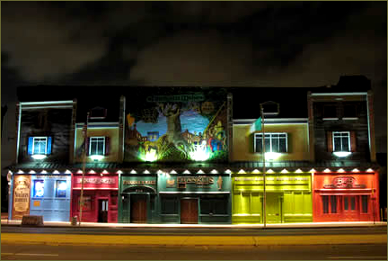 An evening shot of the colorful front of Finnegan's Wake, from the website