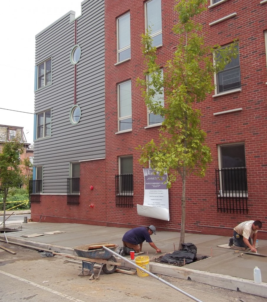 Laying the concrete in front of Jannie's Place. | Kara Savidge for Philadelphia Neighborhoods
