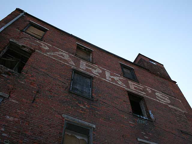 The warehouse at Front and Girard had many lives before being destroyed by fire Tuesday. via Ghost Sign Project c. 2006