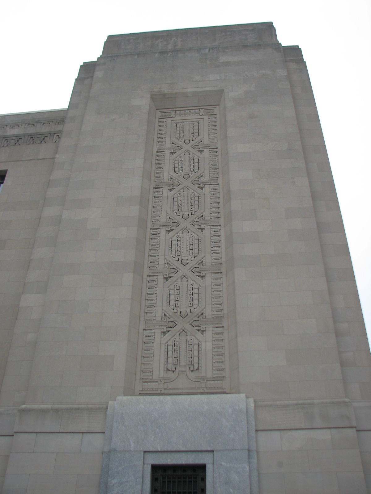 The pylons of the building are adorned with elaborate patterns.