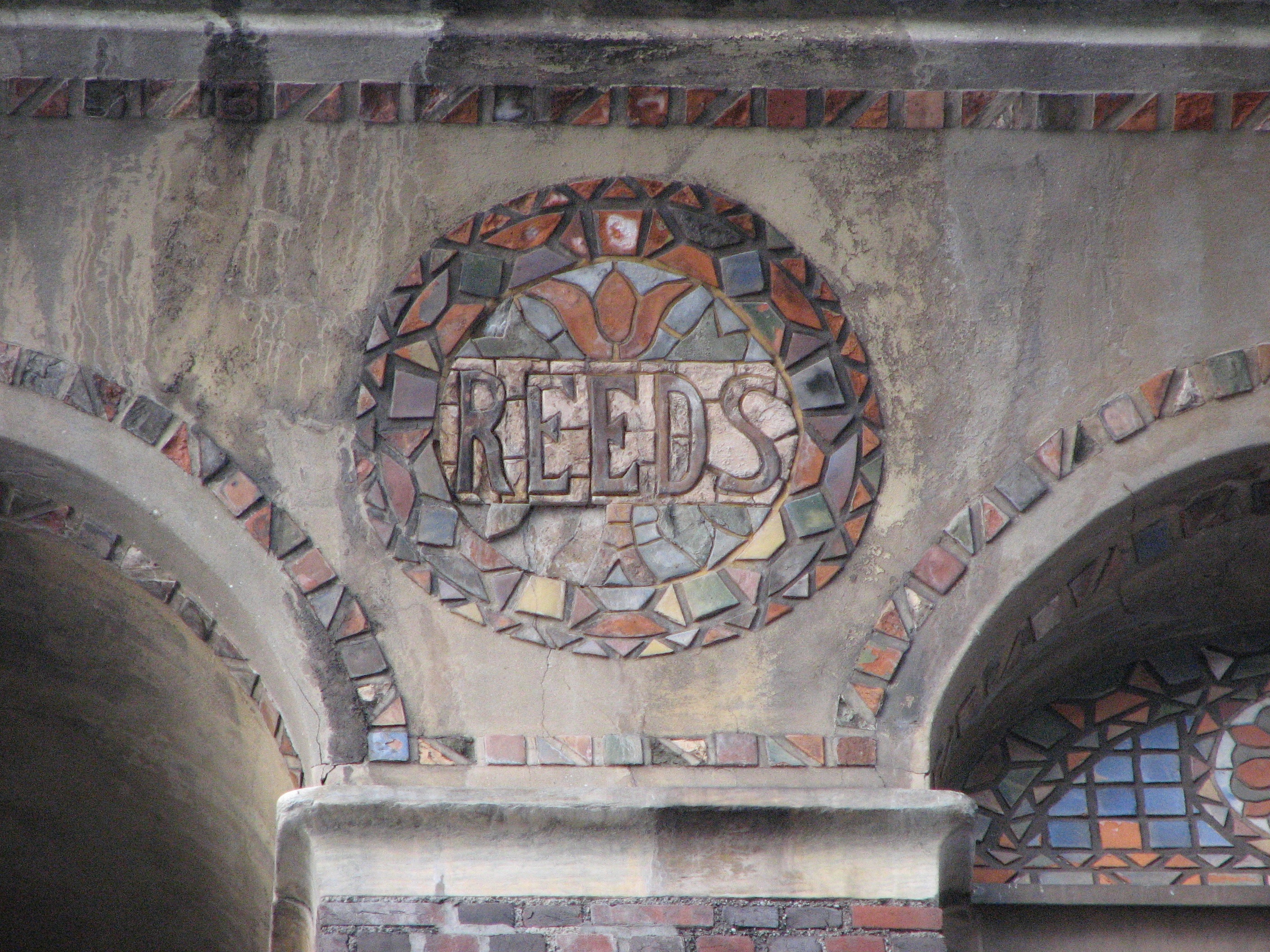 The Reeds name is spelled in handmade tiles at the top of the building.