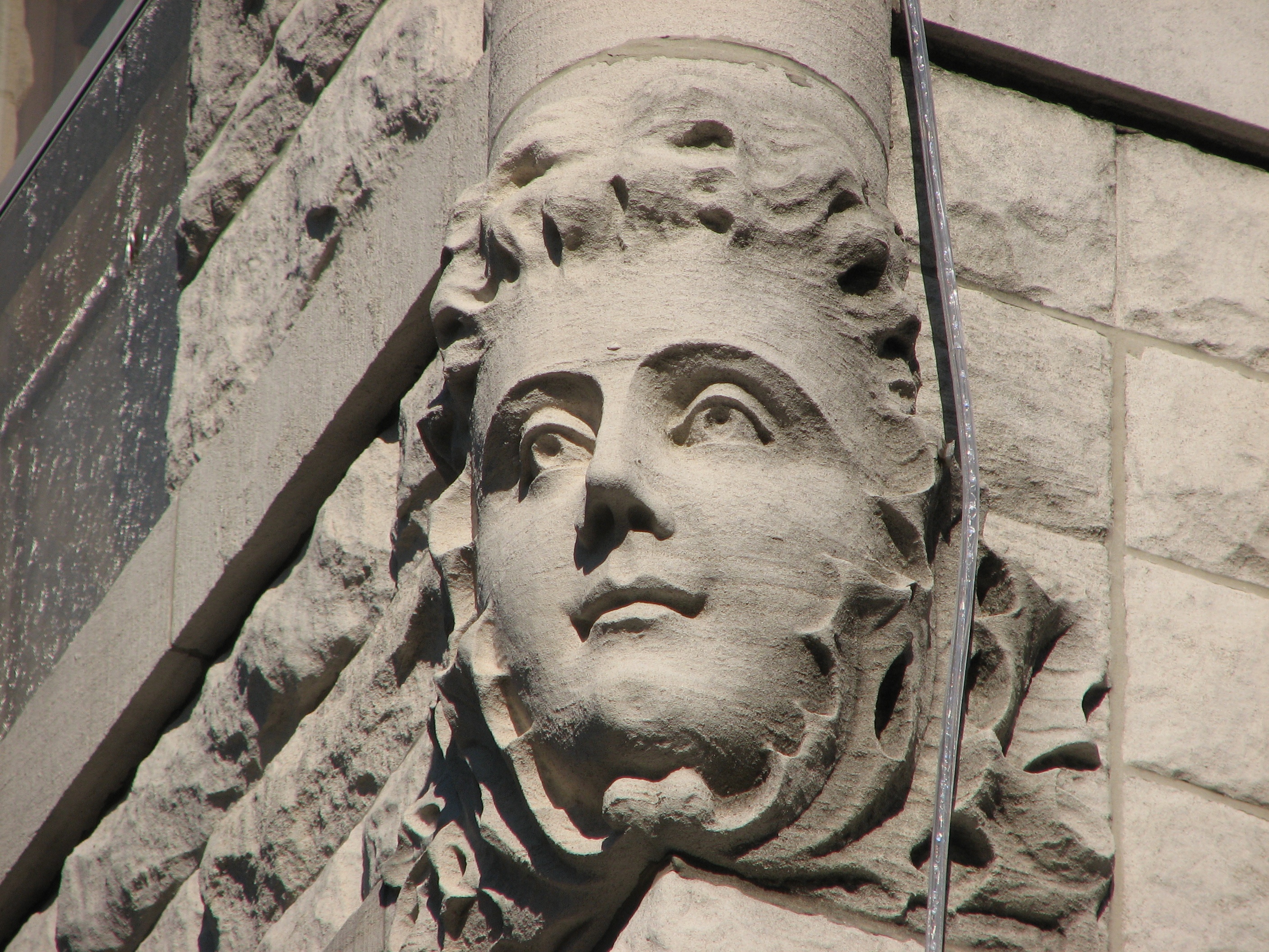 Carved faces on the house's exterior and interior are reportedly those of William Swain's children.