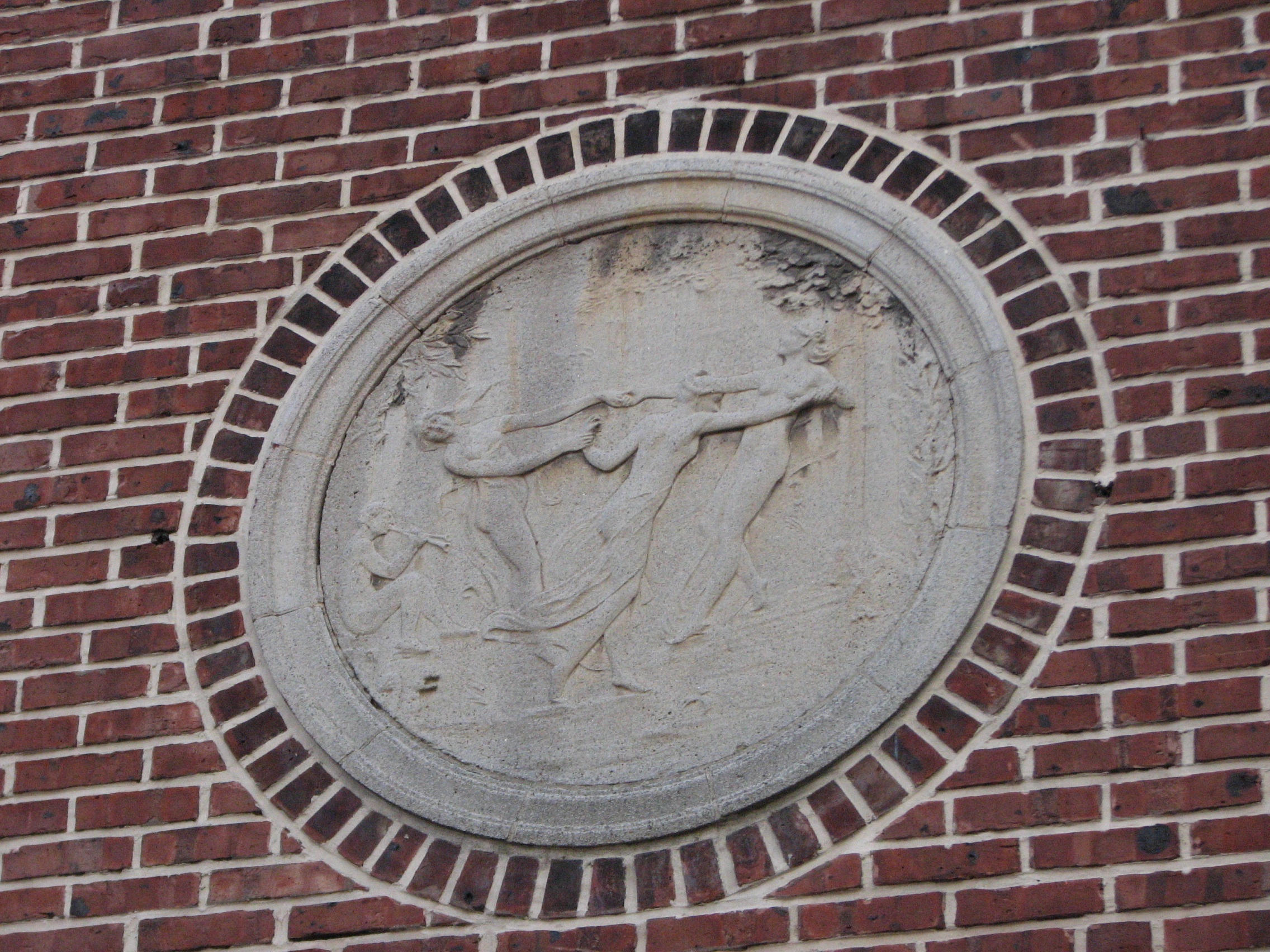 The original design included theatrical bas reliefs on the front of the building.