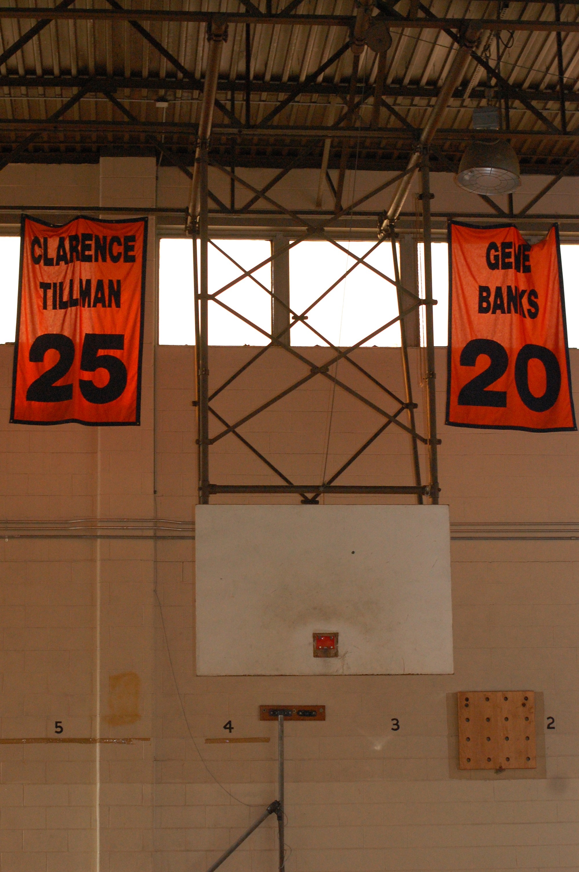 Banners honoring W. Philly legends of the past hang above a broken backboard.