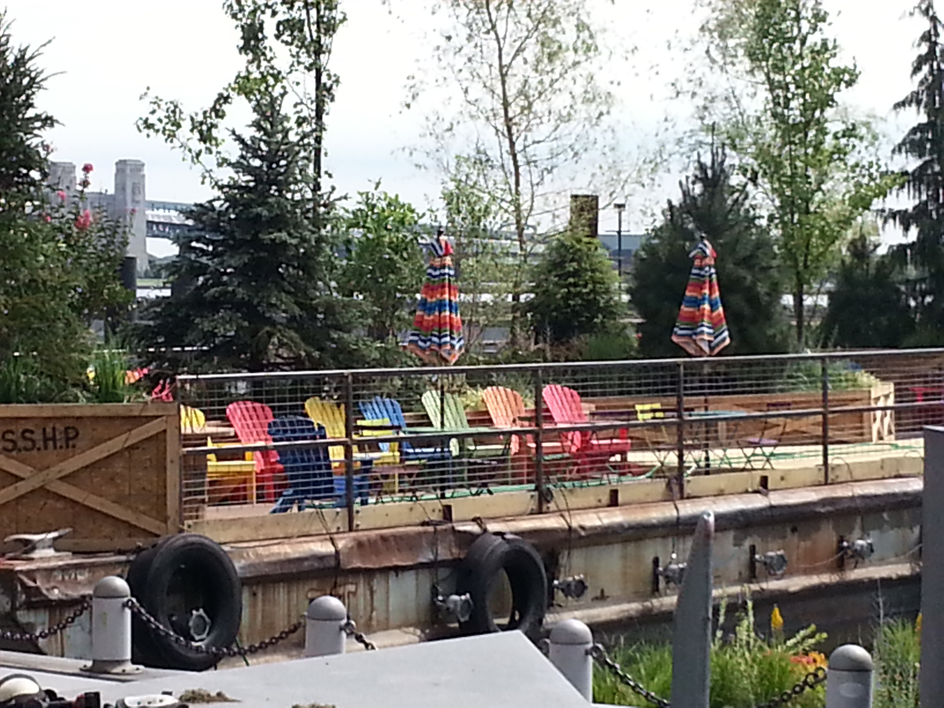 Colorful chairs lined up on one of the three Spruce Street Harbor Park barges