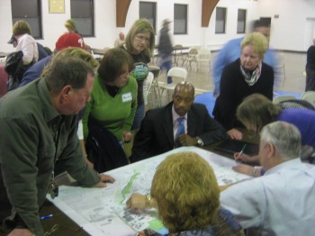 At a February 2011 meeting, Upper Holmesburg residents review neighborhood plans. Civic Association member Paul DeFinis (not pictured) is a graduate of the Citizens Planning Institute. File Photo/Shan