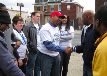 Mayor Michael Nutter (hat) meets Heavy Hitta's boxing coach Lonnie Haile at the 2011 Philly Spring Cleanup on Rising Sun Avenue. Also pictured on left are clean-up organizers Kathy Wersinger of 9t