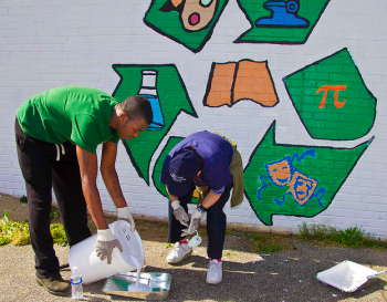 A mural at Max Myers Rec Center gets a fresh coat of paint during Philly Spring Cleanup. Photo/Michelle Alton