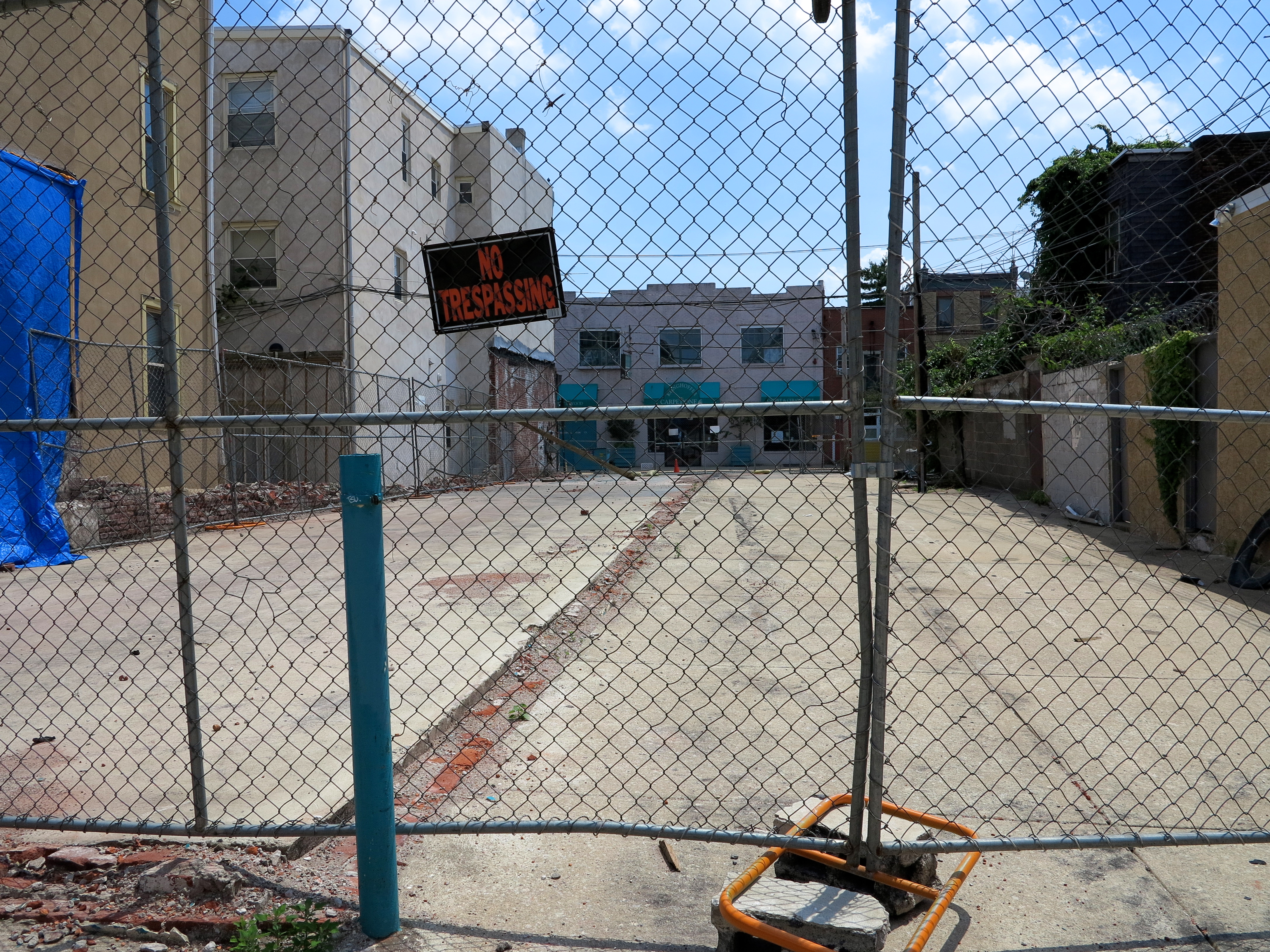 Cleared lot slated for garage-fronted rowhouses, 700 block of Kater looking toward Bainbridge