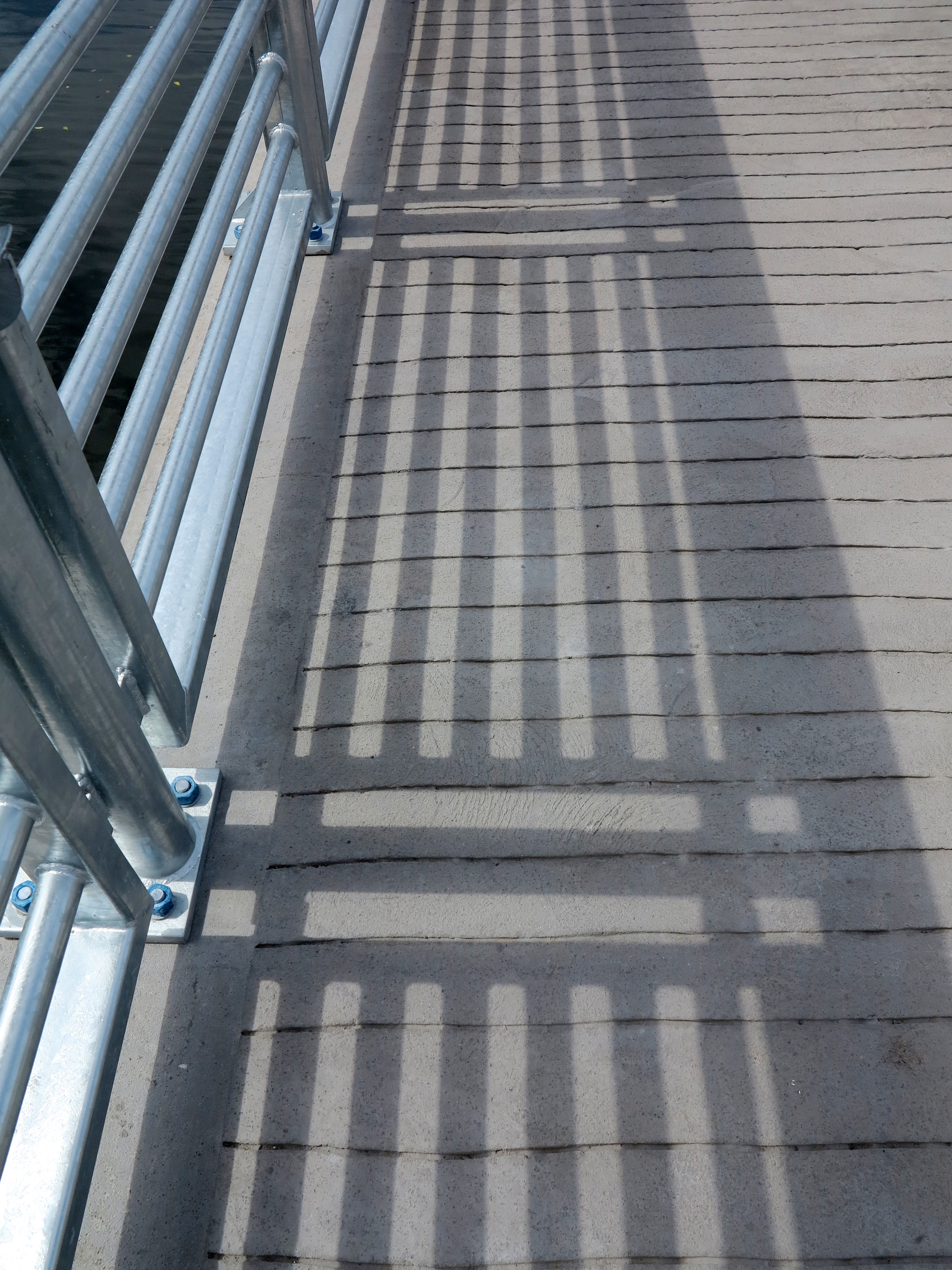 Boardwalk textures: Scored concrete, stainless stell railings