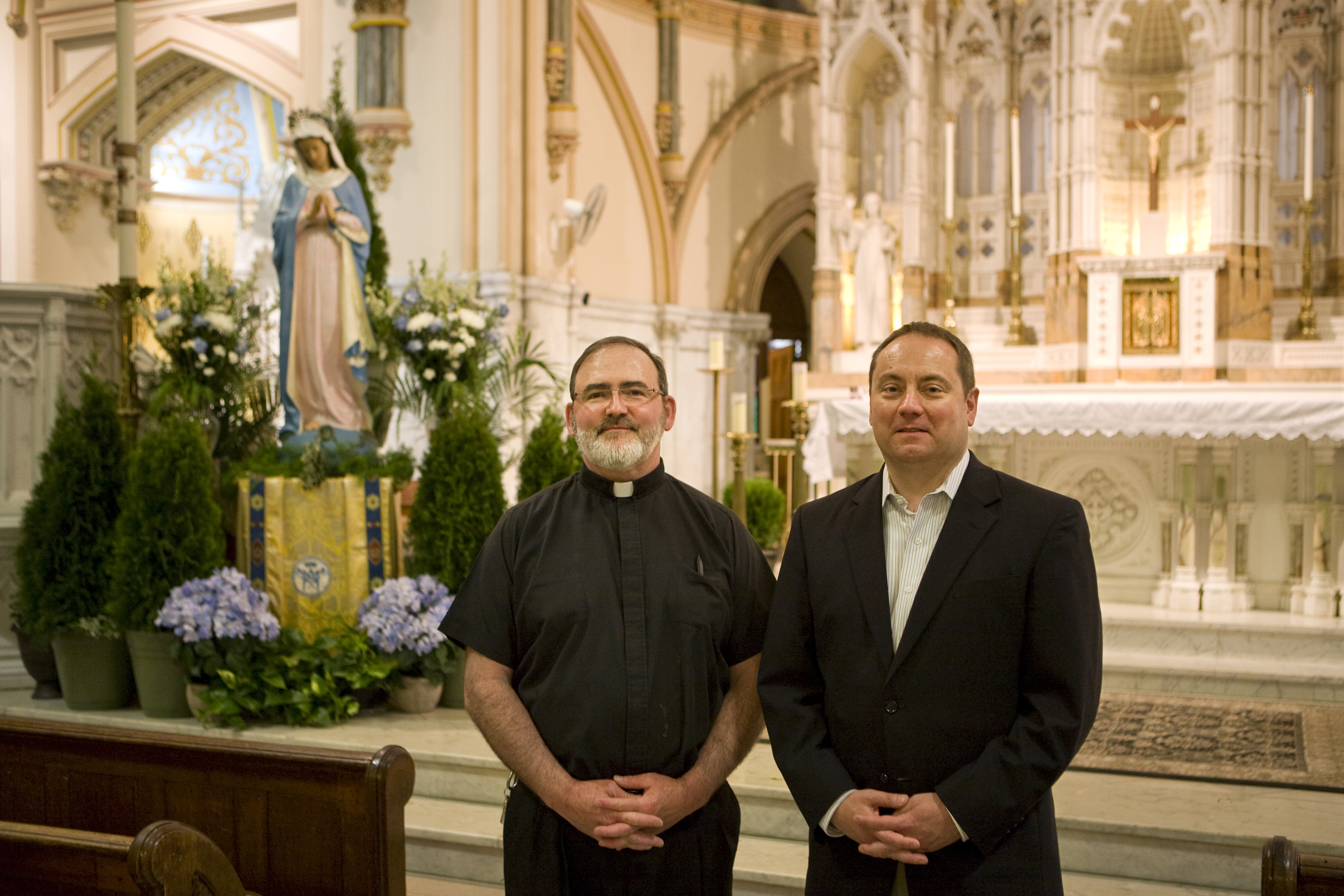 Father Kevin Lawrence (left) and Rich Van Fossen in the sanctuary of Saint John the Baptist, 2015 | Credit: Bradley Maule