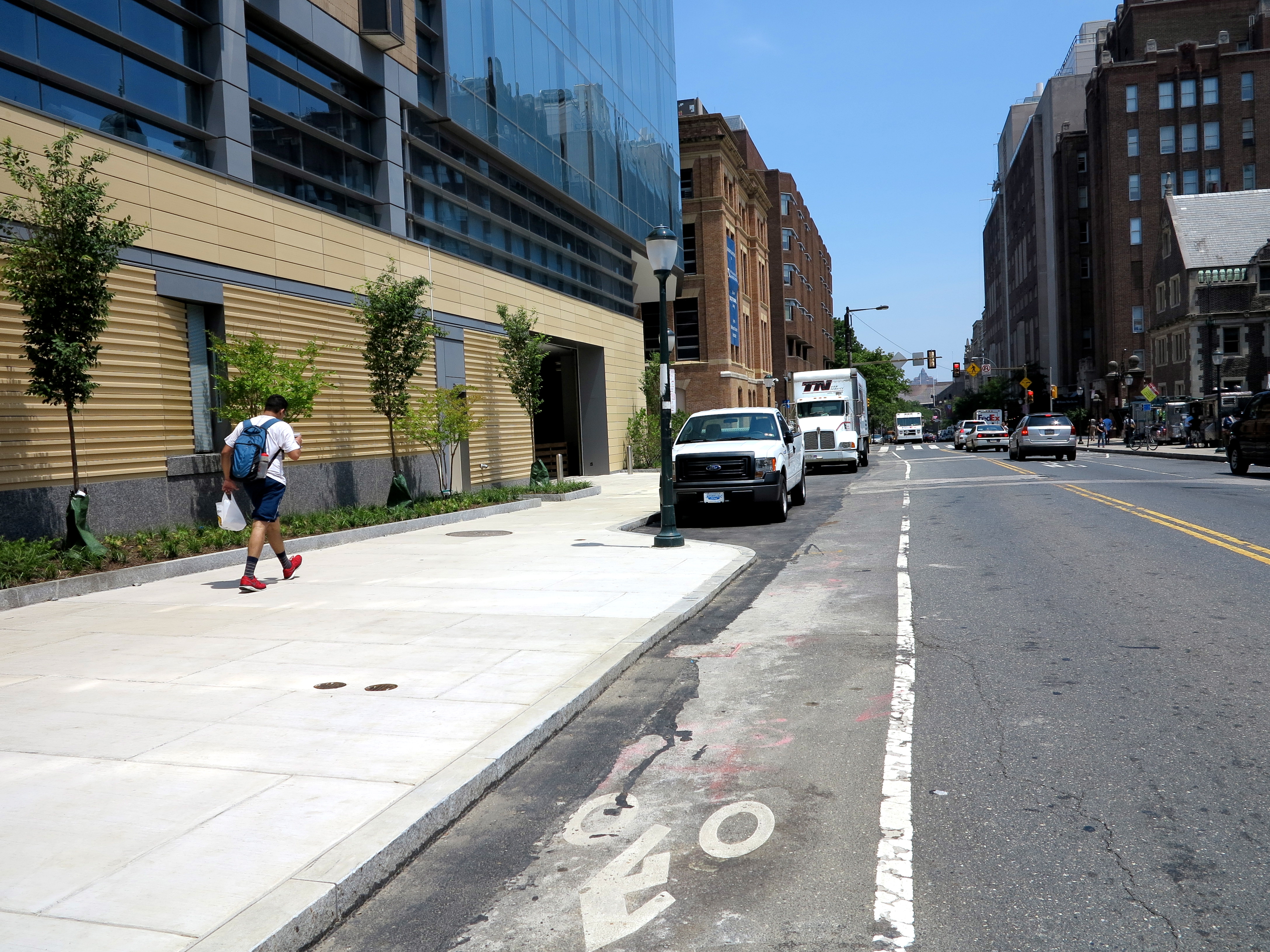 Generous sidewalks and a bike lane along Spruce Street outside the expanded Wistar Institute.