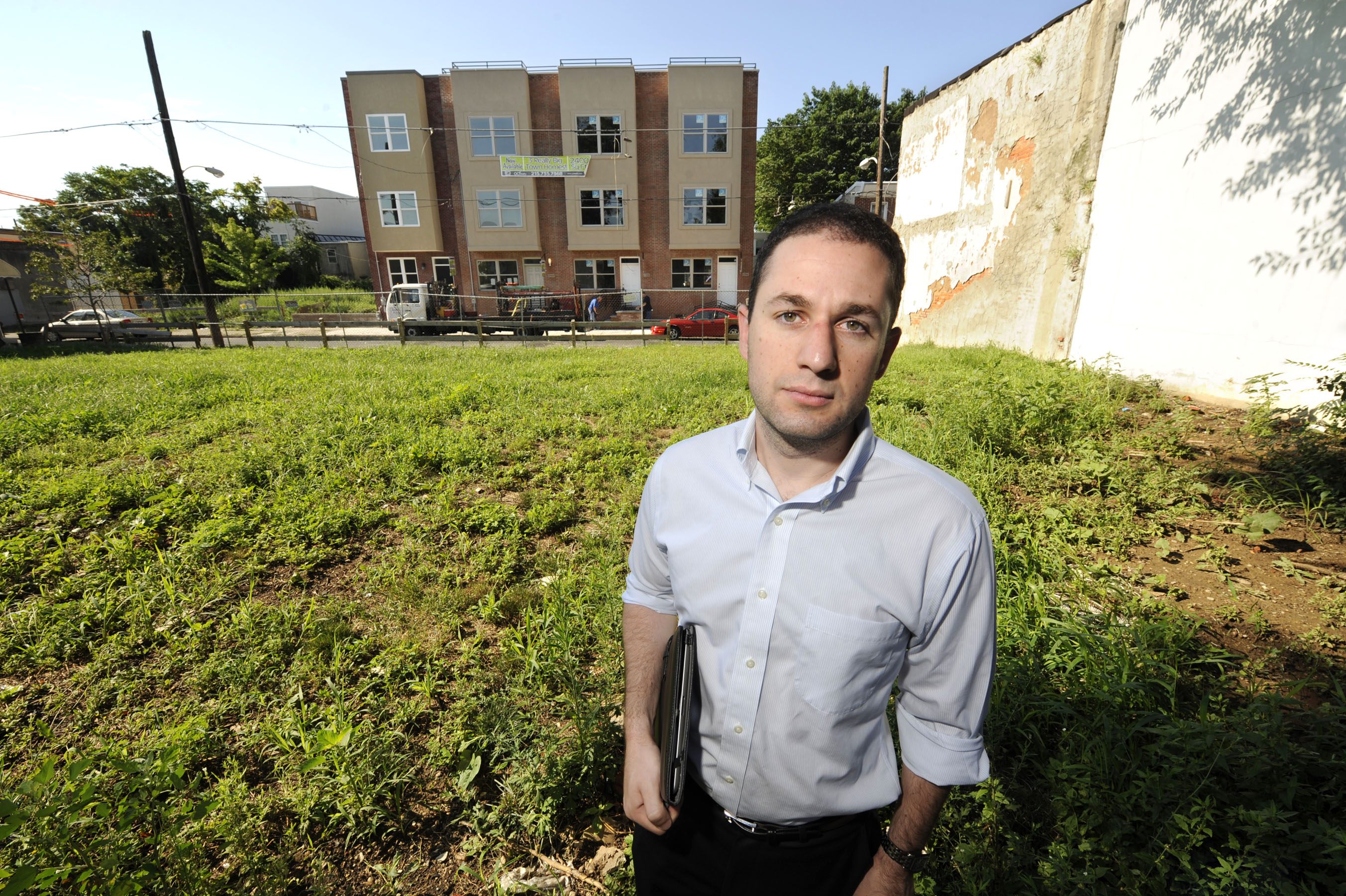 A file photo of developer Ori Feibush in a vacant lot across from homes he built he built in Point Breeze. 