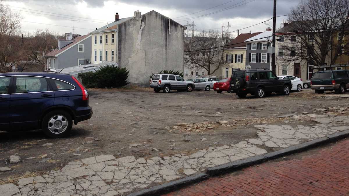 This small lot at 147 Gay Street — which offers spots for 30 vehicles — has become a flash point pitting residents against developers. (Neema Roshania/WHYY)
