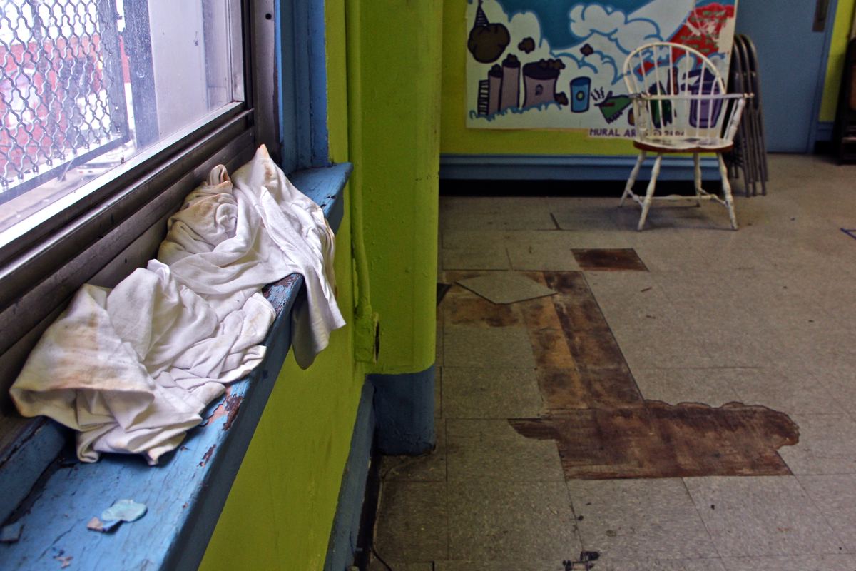 A T-shirt catches the drips from a leaking window frame at Vare Rec Center, one of the 61 sites selected for improvements funded by Rebuild. 