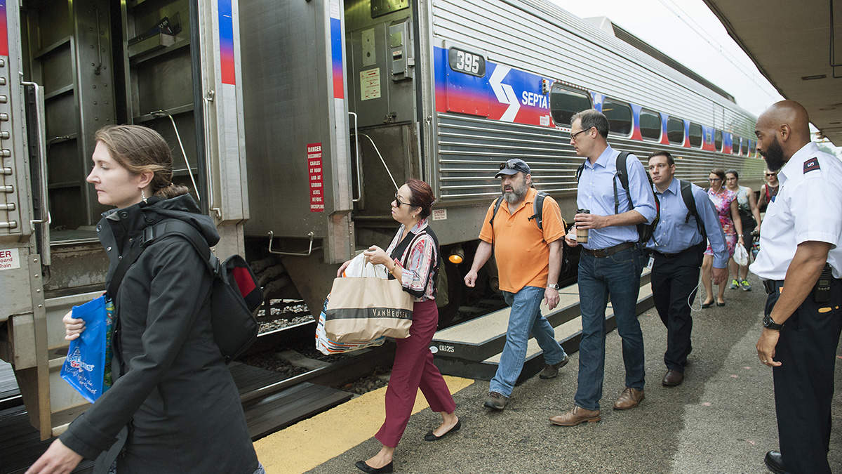 At the Ardmore Station passengers board a train going to Philadelphia. SEPTA trains are running on a modified Saturday schedule. (Jonathan Wilson for Newsworks)