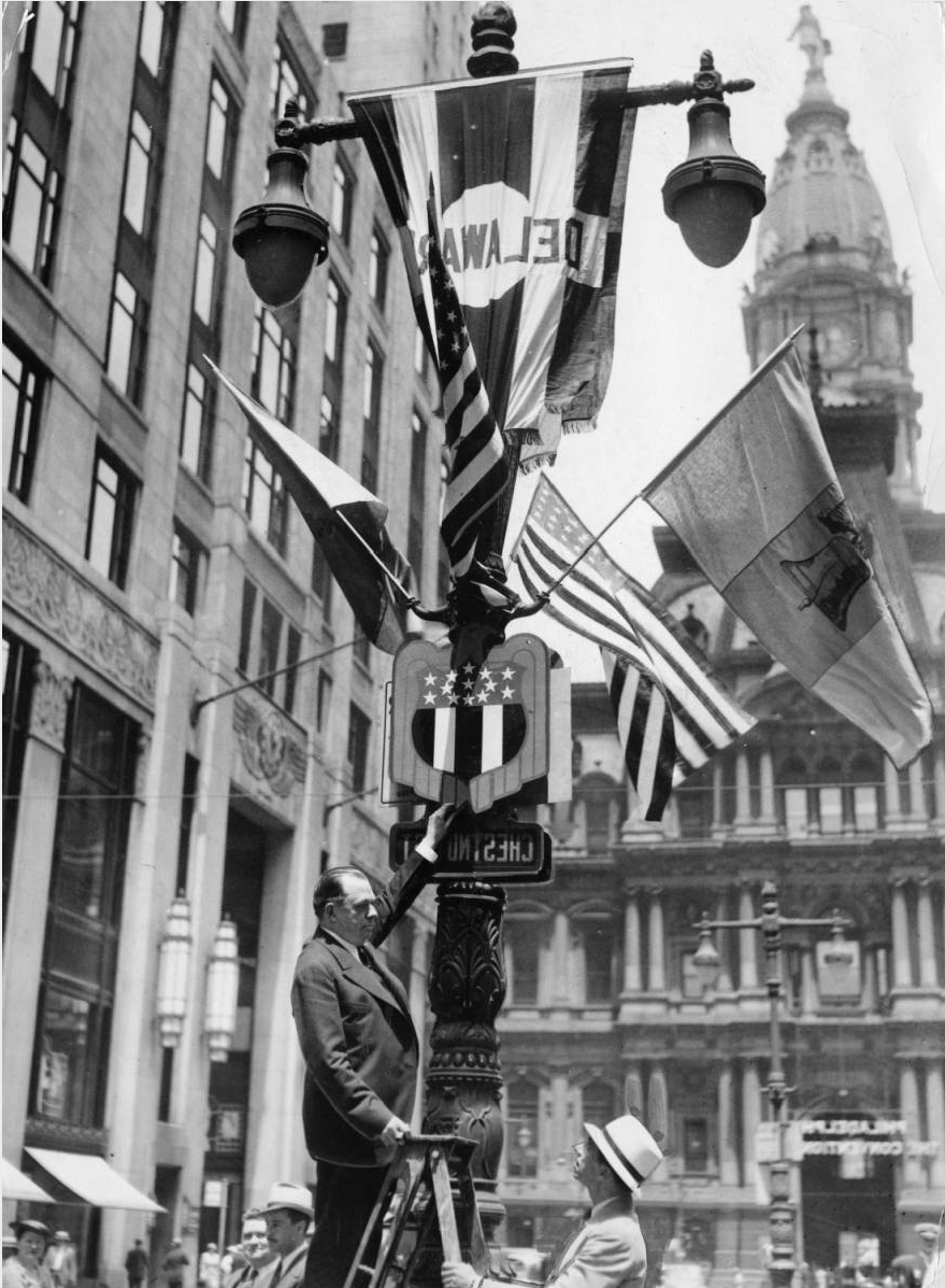 City officials decorate a lamp post for the 1936 Democratic National Convention. | Special Collections Research Center, Temple University Library, Philadelphia PA
