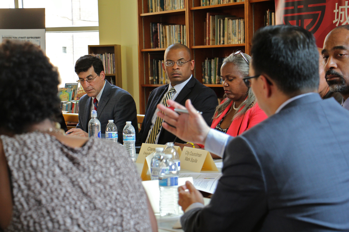 U.S. Transportation Secretary Anthony Foxx (center)  listens to John Chin, director of the Philadelphia Chinatown Development Corporation, during a roundtable discussion at Holy Redeemer Chinese Catholic School. (Emma Lee/WHYY)