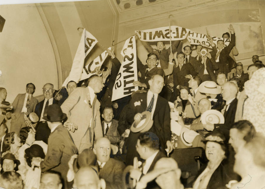 A chaotic crowd of Al Smith supporters displayed signs that read Al Smith is a Real Democrat. The crowd broke out into fists fights and were forcibly removed after ten minutes from the Democratic National Convention. Philadelphia, June 26, 1936| Evening Bulletin | Special Collections Research Center, Temple University Libraries, Philadelphia, PA 