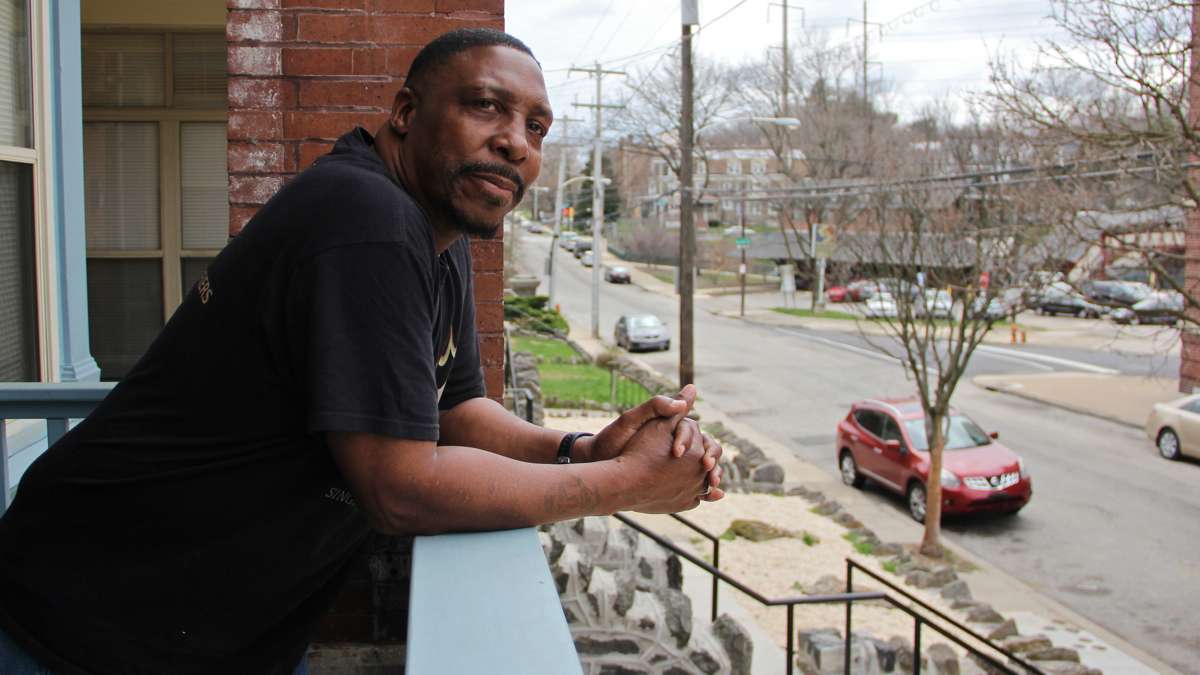 Former Blumberg resident James Norcome at his new Queen's Row. | Emma Lee/WHYY