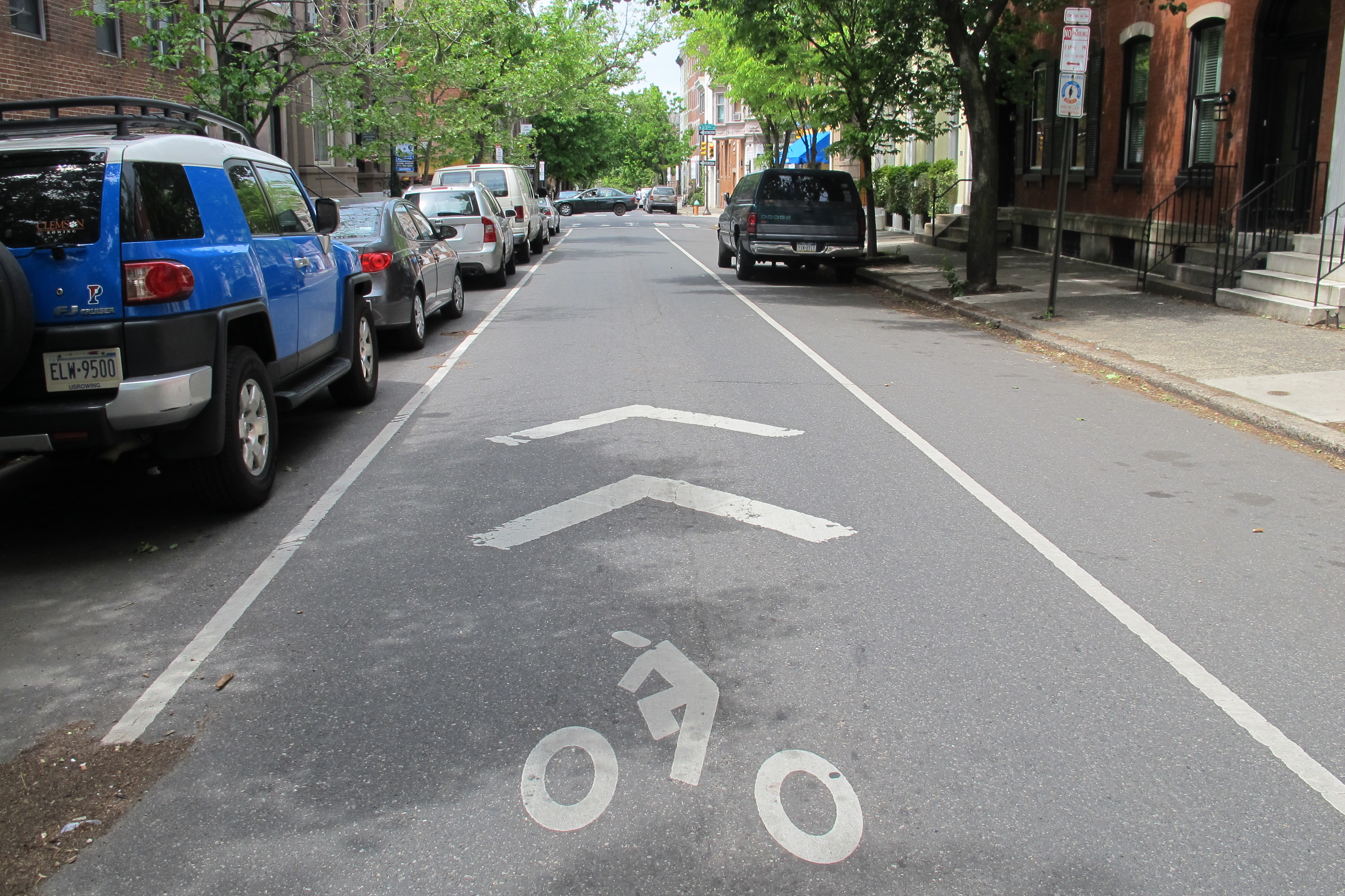 Sharrows , like this one on Spruce Street, are meant to direct bicycle traffic and instruct drivers and cyclists to share the road.