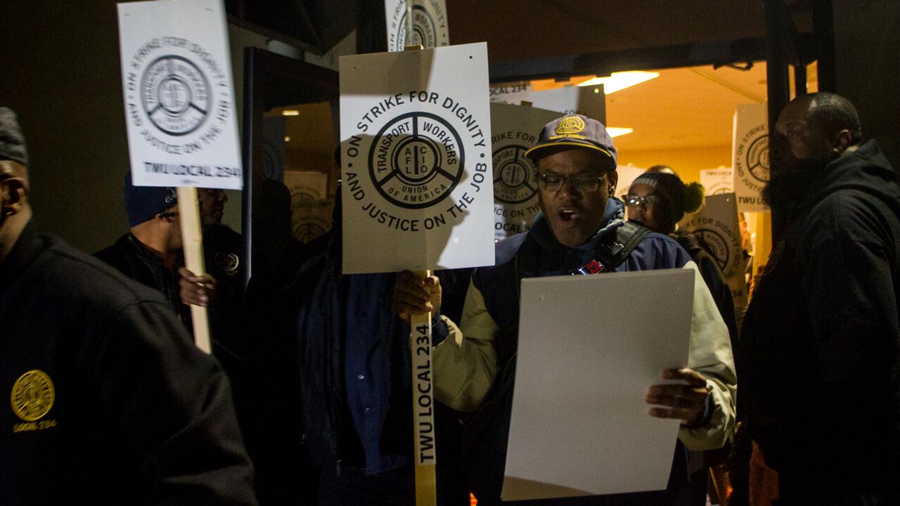 TWU Local 234 workers rallied at their union hall on Oct. 28 and distributed strike signs for the picket lines (Brad Larrison for WHYY)