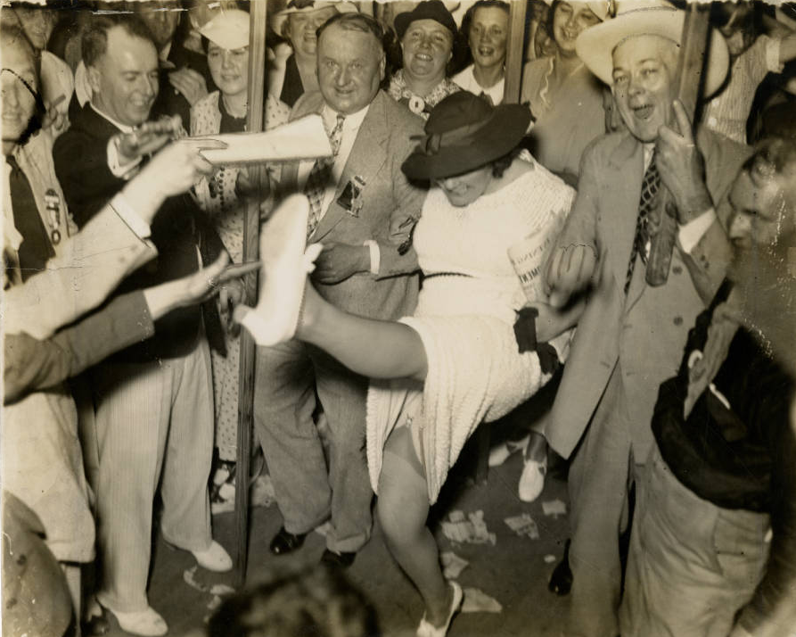 Woman trying to kick off her own hat for Roosevelt at Democratic Convention, Philadelphia 1936. | Evening Bulletin | Special Collections Research Center, Temple University Libraries, Philadelphia, PA