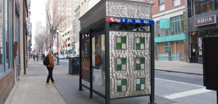 A bus stop at 7th and Chestnut streets, with stained-glass at its eastern side. | Ashley Hahn