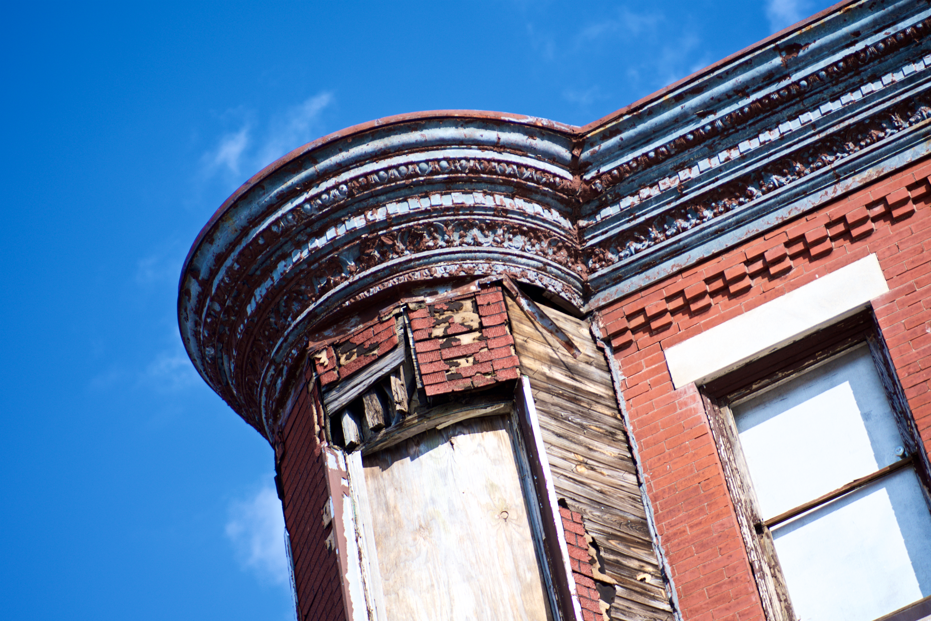 Architectural details on a historic residence in need of repair. (Bas Slabber/WHYY)