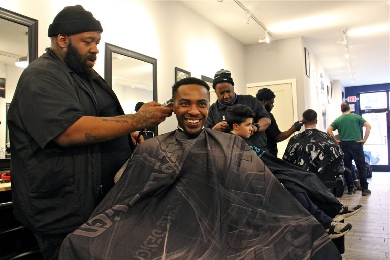 “Barbering is not just cutting hair,” South Street Barbers' Mike Jordan says. “You got counseling, advising, you get friendships. Credit: Emma Lee/WHYY