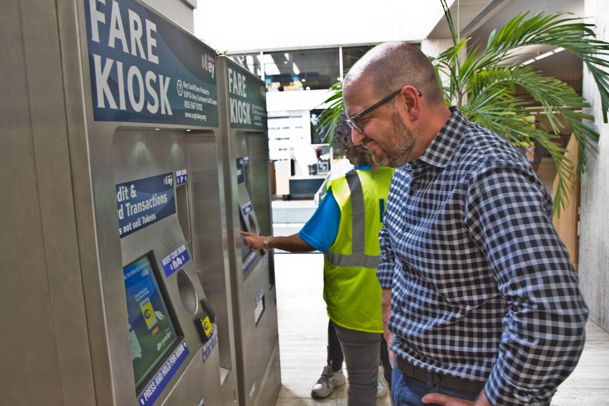 Brian McIntire evaluates the new user interfaces of the SEPTA Key Fare Kiosk (Kim Paynter/WHYYY)