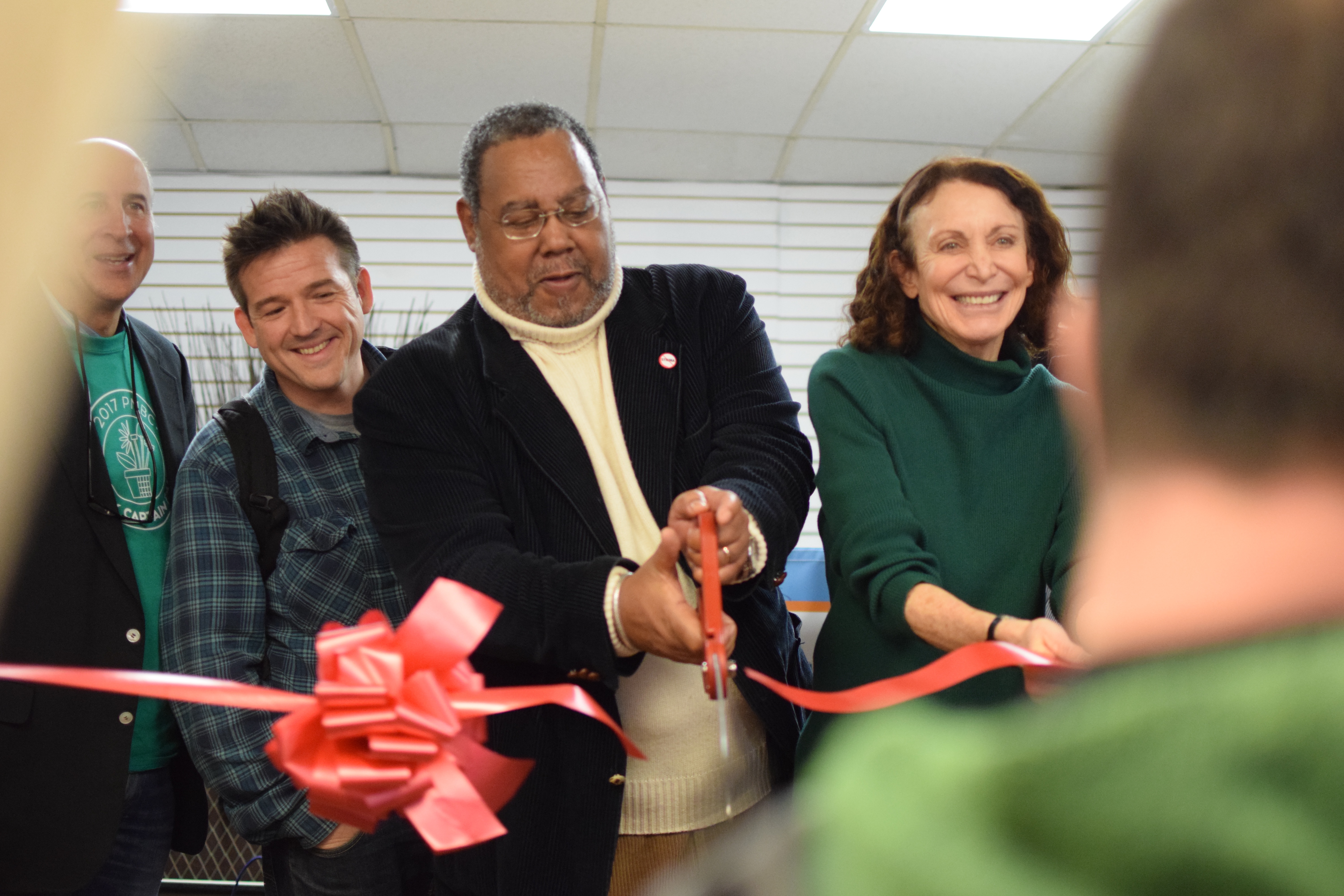 Cutting the ribbon at Kensington Storefront, March 25, 2017 | Grace Shallow / PlanPhilly