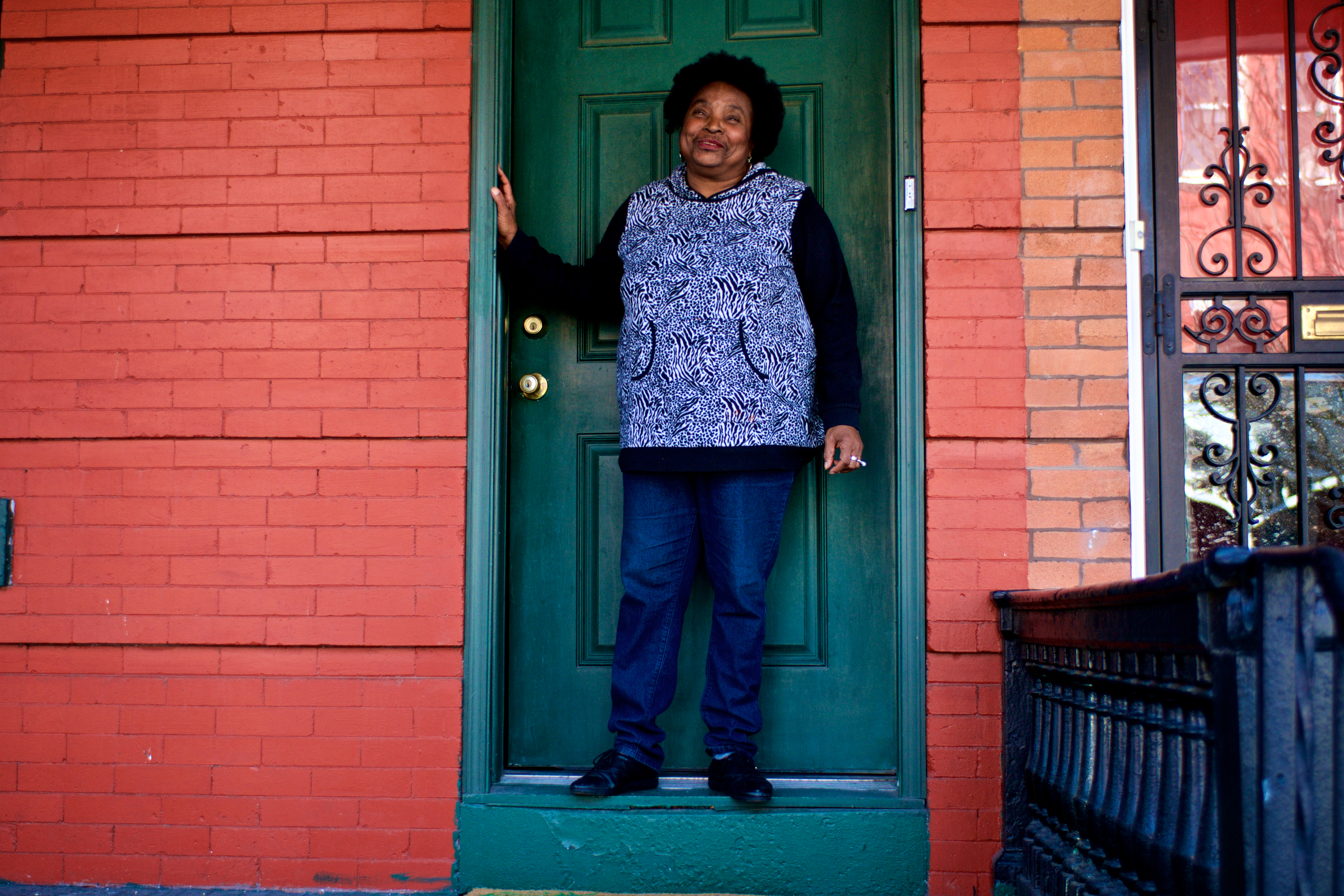 Denise Clark in front of her home. (Bas Slabbers/WHYY)
