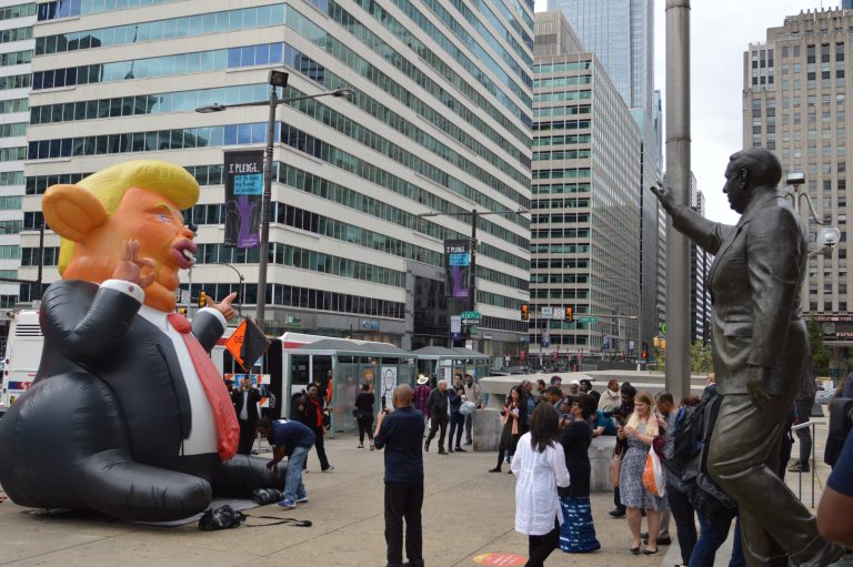 Donald Trump rat is across from Rizzo statue outside the Municipal Services Building in Philadelphia. (Tom MacDonald/WHYY)