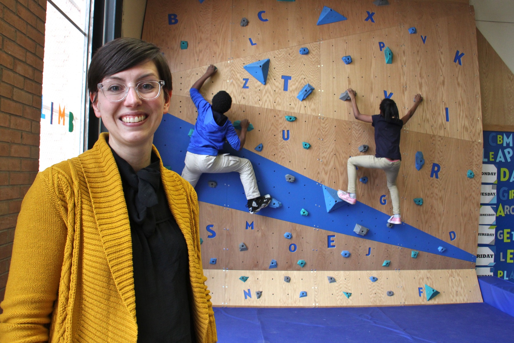 Meghan Talarowski of Studio Ludo designed the climbing wall at the Cecil B. Moore library with the idea that children need risky play. (Emma Lee/WHYY)