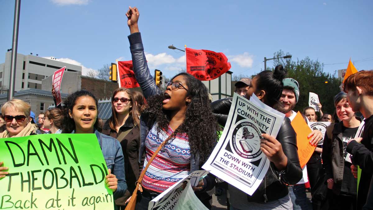 Neighbors and students in an April 2016 protest march against a proposed new football stadium. (Emma Lee/WHYY)