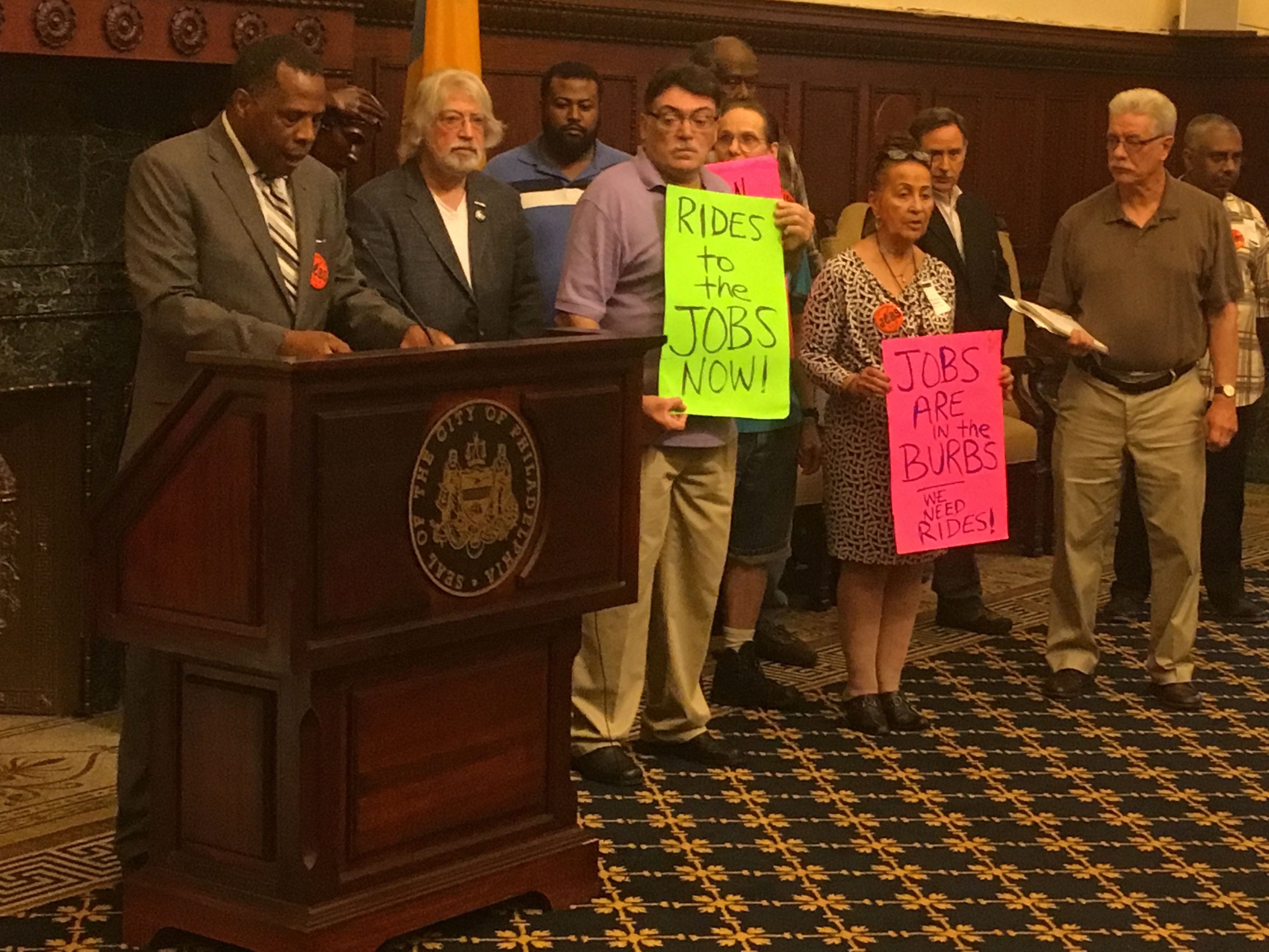 Philadelphia Unemployment Project board members and supporters rally in the mayor's reception room for more reverse commuter vanpool funds