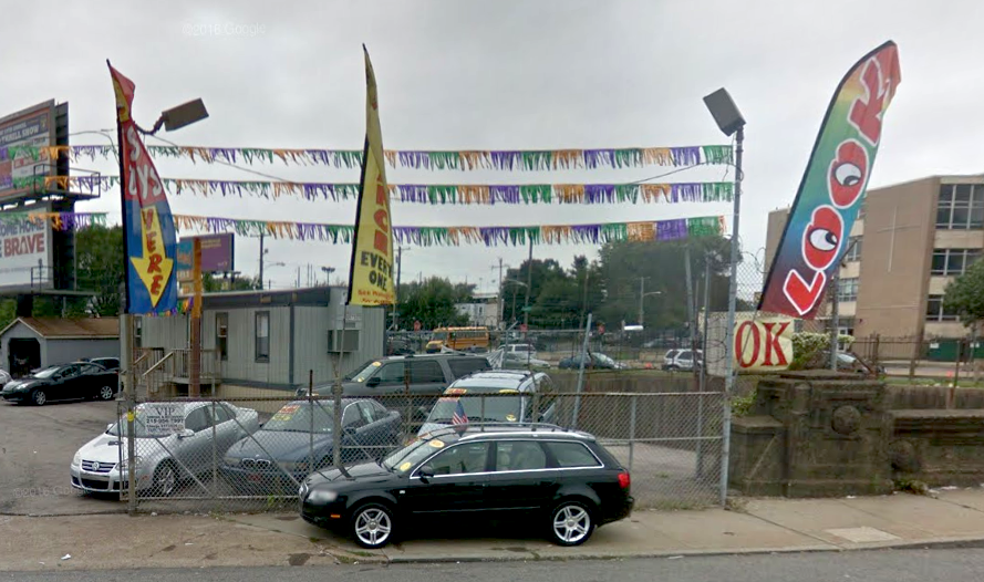 Portable feather signs hanging at an auto lot in Northeast Philadelphia | Google Street View, 2014
