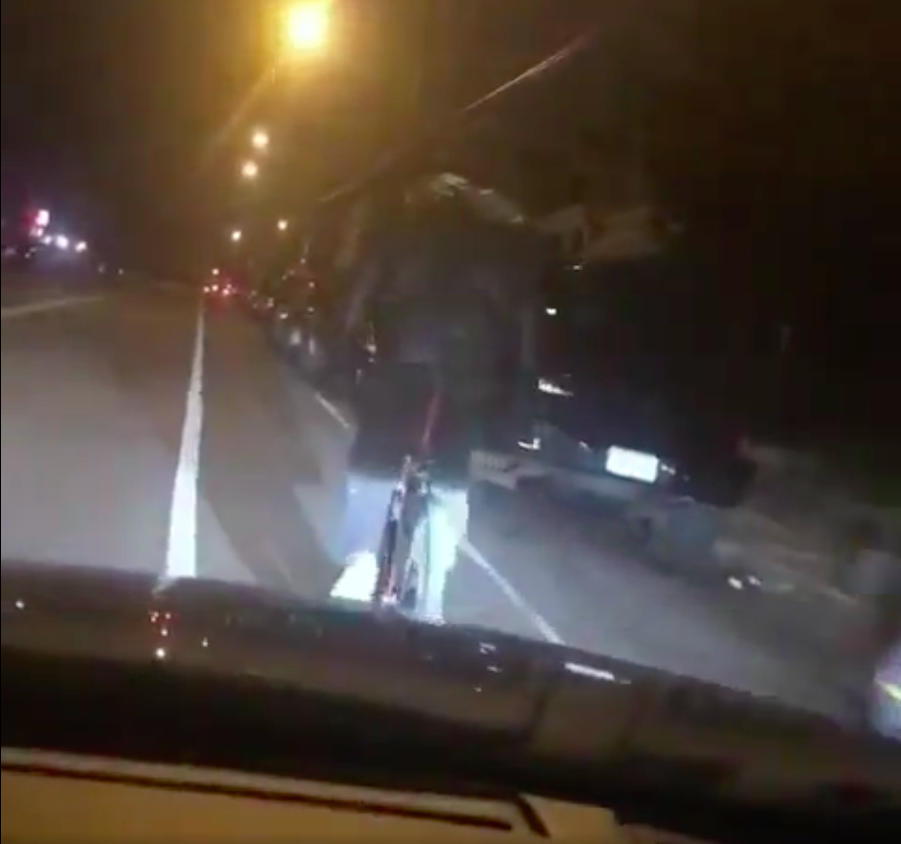 Screen shot of video showing what appears to be an intentional hit-and-run of a cyclist 