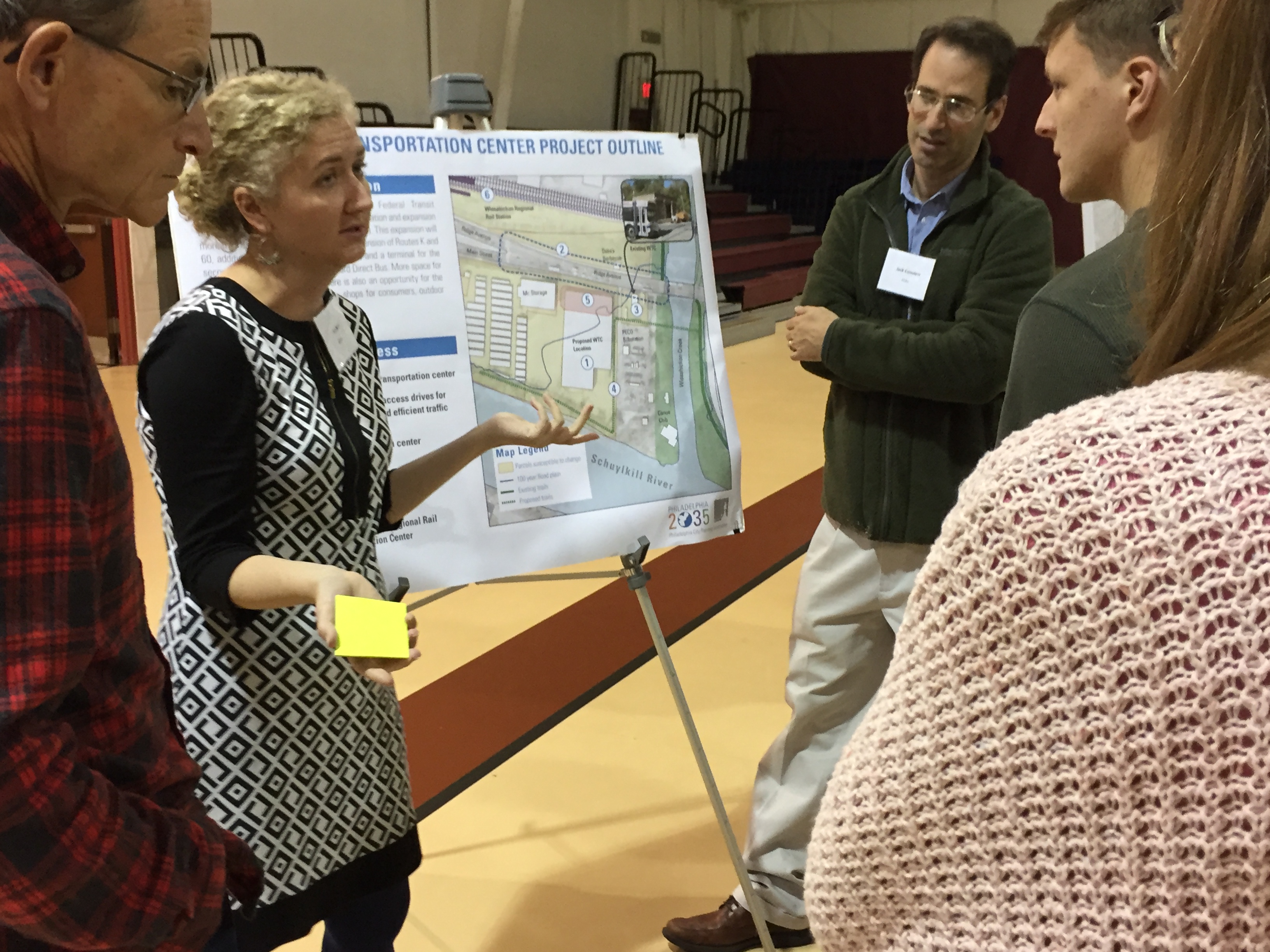 SEPTA Planner Jennifer Barr talks with local residents