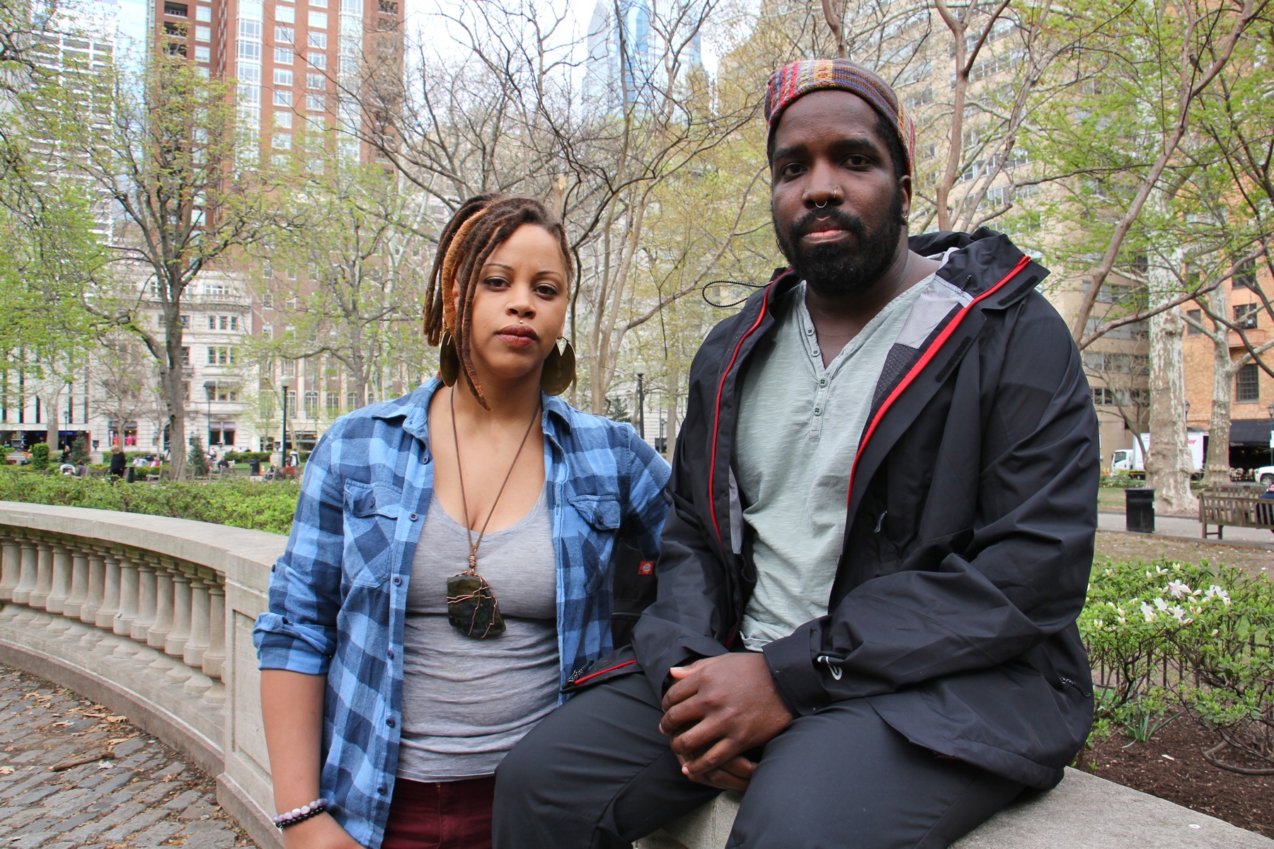 Shani Akilah and Abdul-Aliy Muhammad with the Black and Brown Workers Cooperative at Rittenhouse Square Park. (Emma Lee/WHYY)