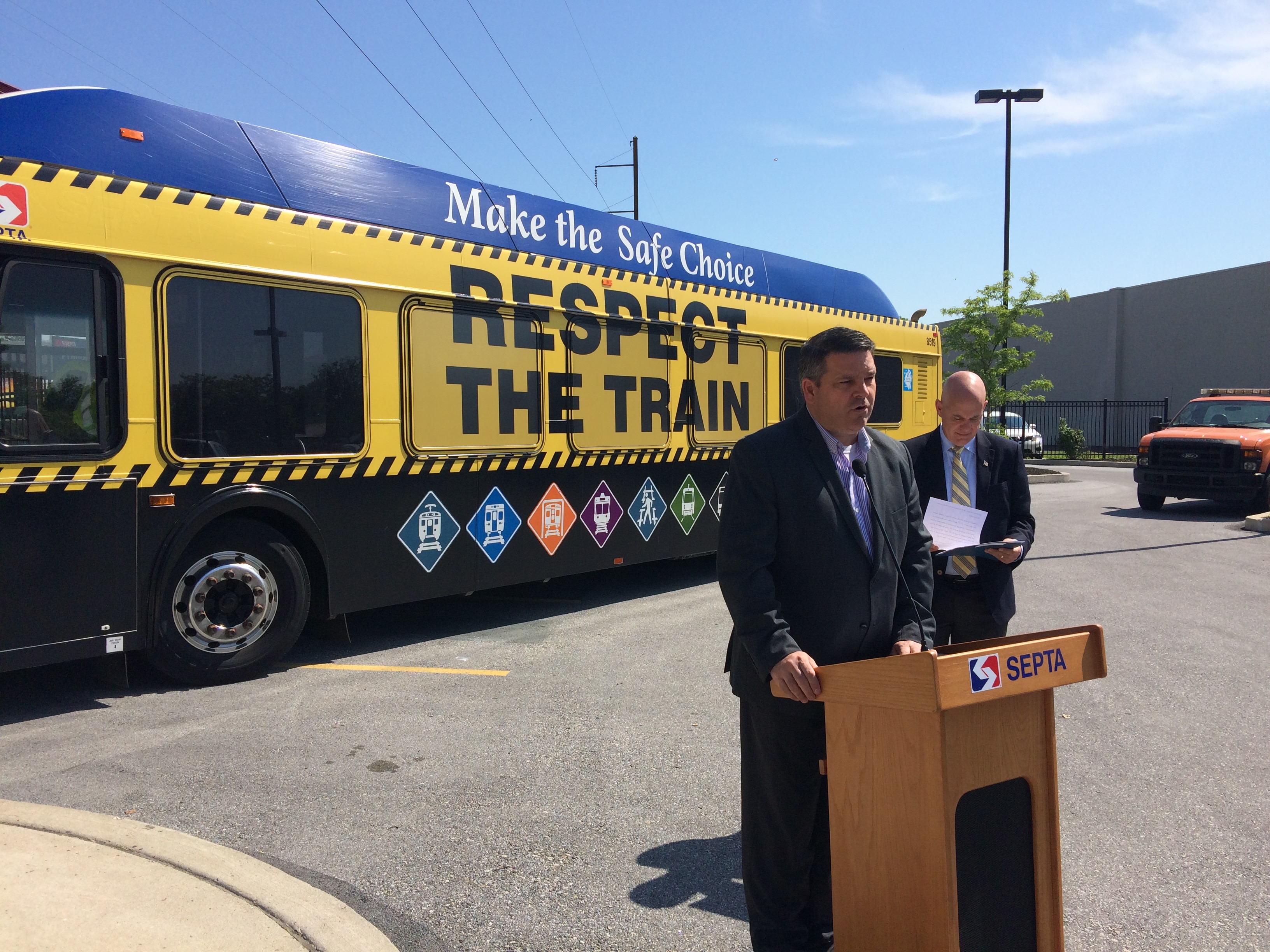 State Rep. Mike Vereb speaks with SEPTA GM Jeff Knueppel behind him at Primros Station for SEPTA's 'Respect The Train' safety-awareness event