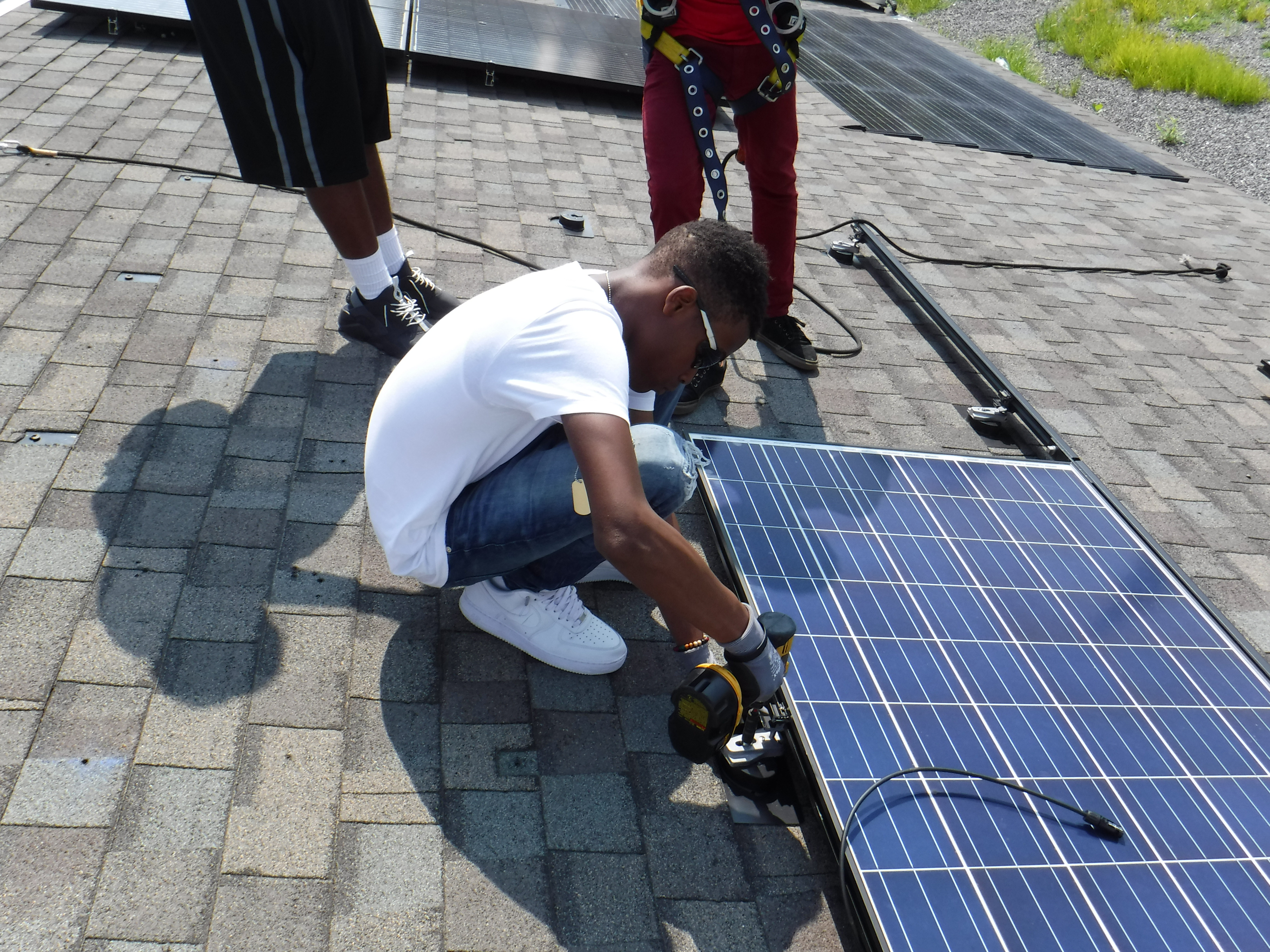 Student trainees receive hands-on experience in solar installation under the supervision of practitioners provided by Philadelphia-based company Solar States.