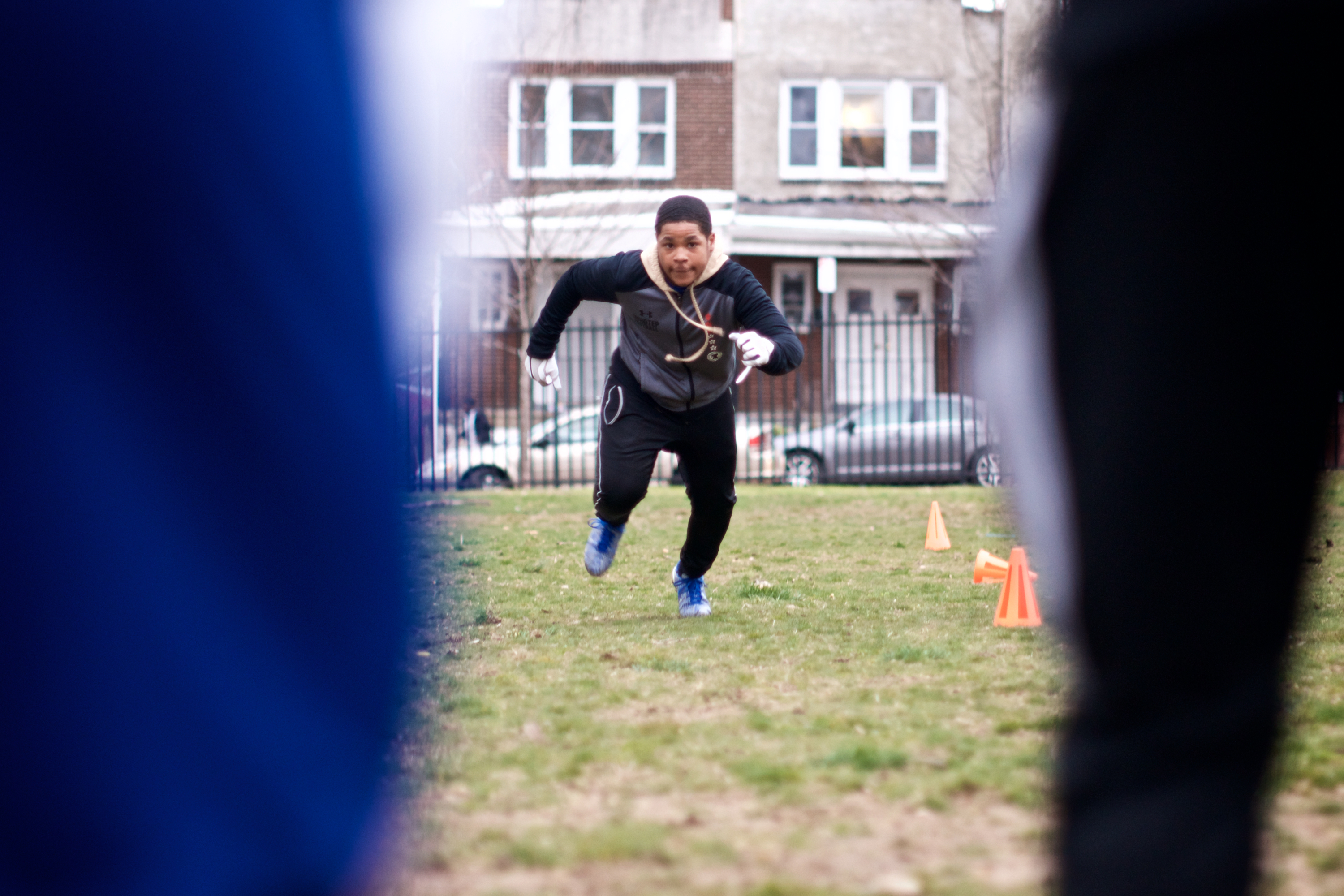 National championship-winning NW Raiders youth football team practices on a patchy city-owned field in East Germantown. (Bastiaan Slabbers for WHYY)