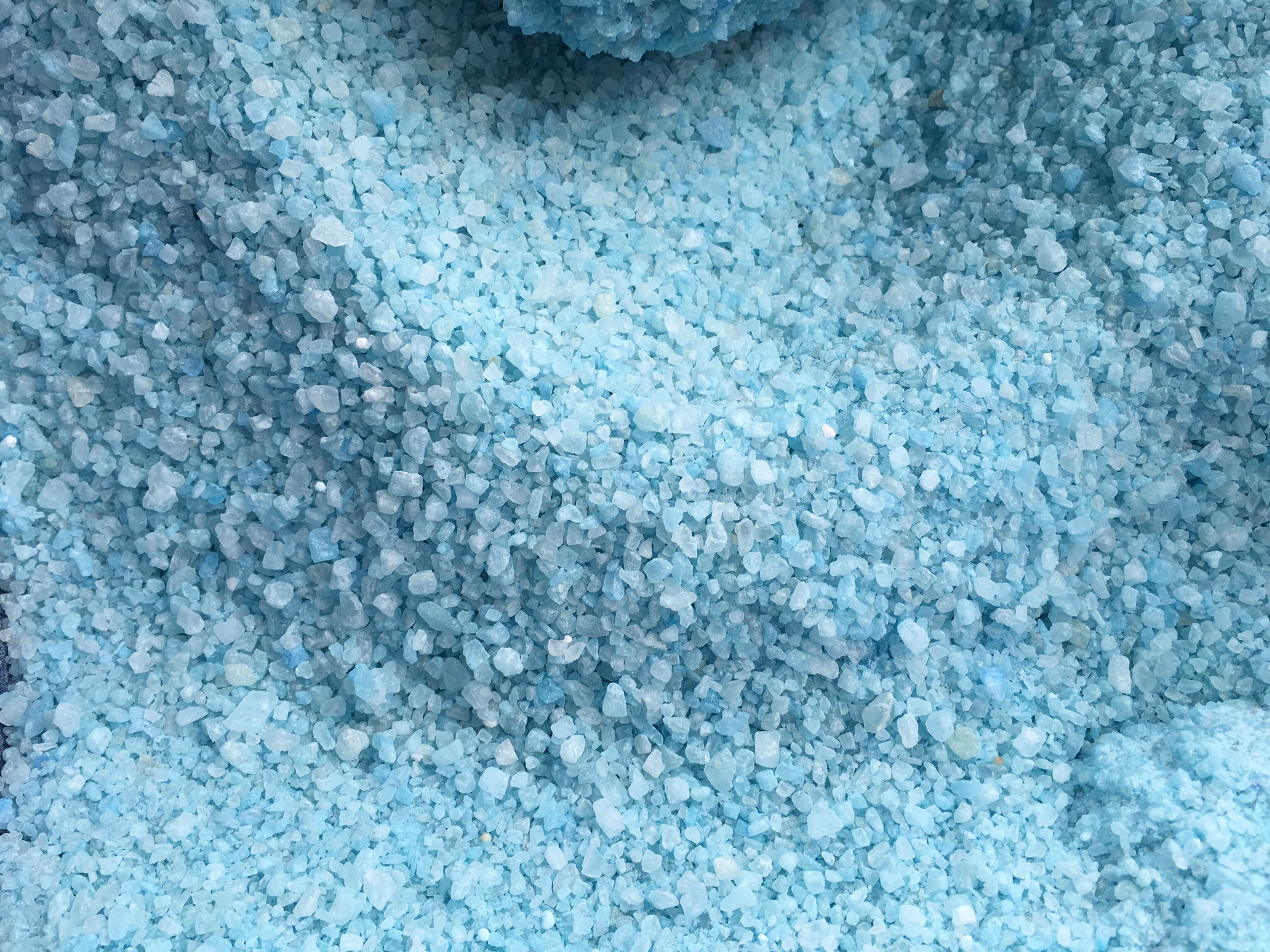 This deicing pellet contains calcium magnesium acetate, which can damage concrete but isn't as corrosive as chloride products.