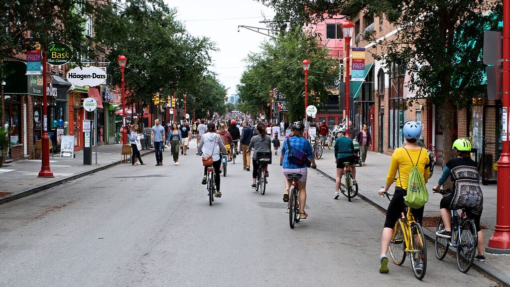 Throngs of cyclists and pedestrians taking advantage of a carless Saturday on South Street during the inaugural Philly Free Streets (Bas Slabbers/For WHYY)