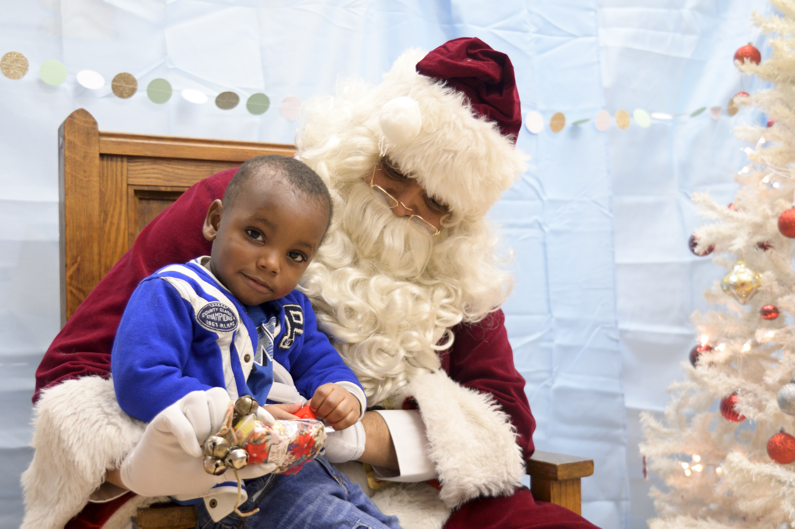 A young boy gets his picture with Santa and the Annual Winter Festival in Olney. Bas Slabbers/WHYY.